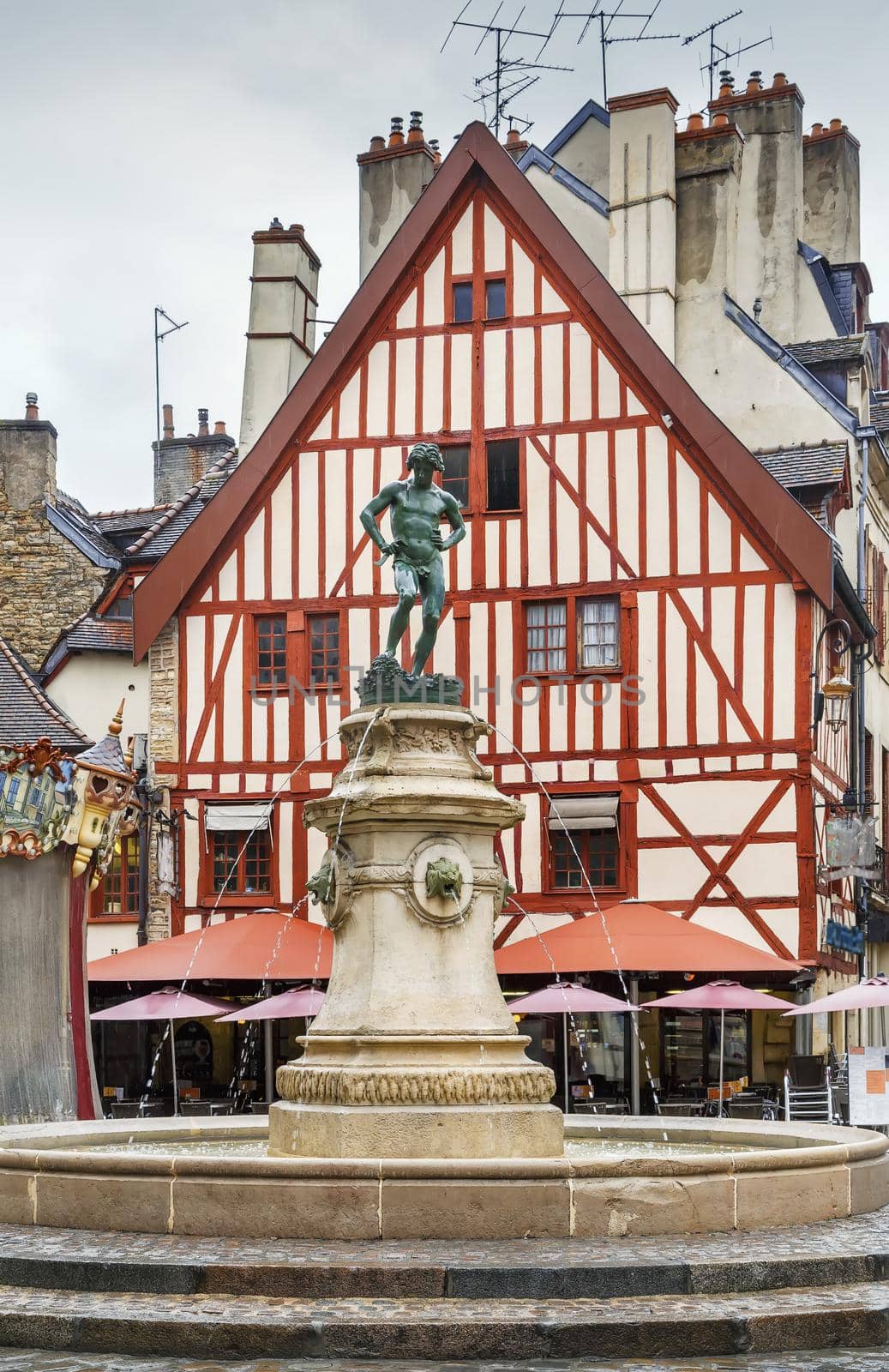 Francois Rude square with fountain of a Bareuzai wine-grower in Dijon, France 