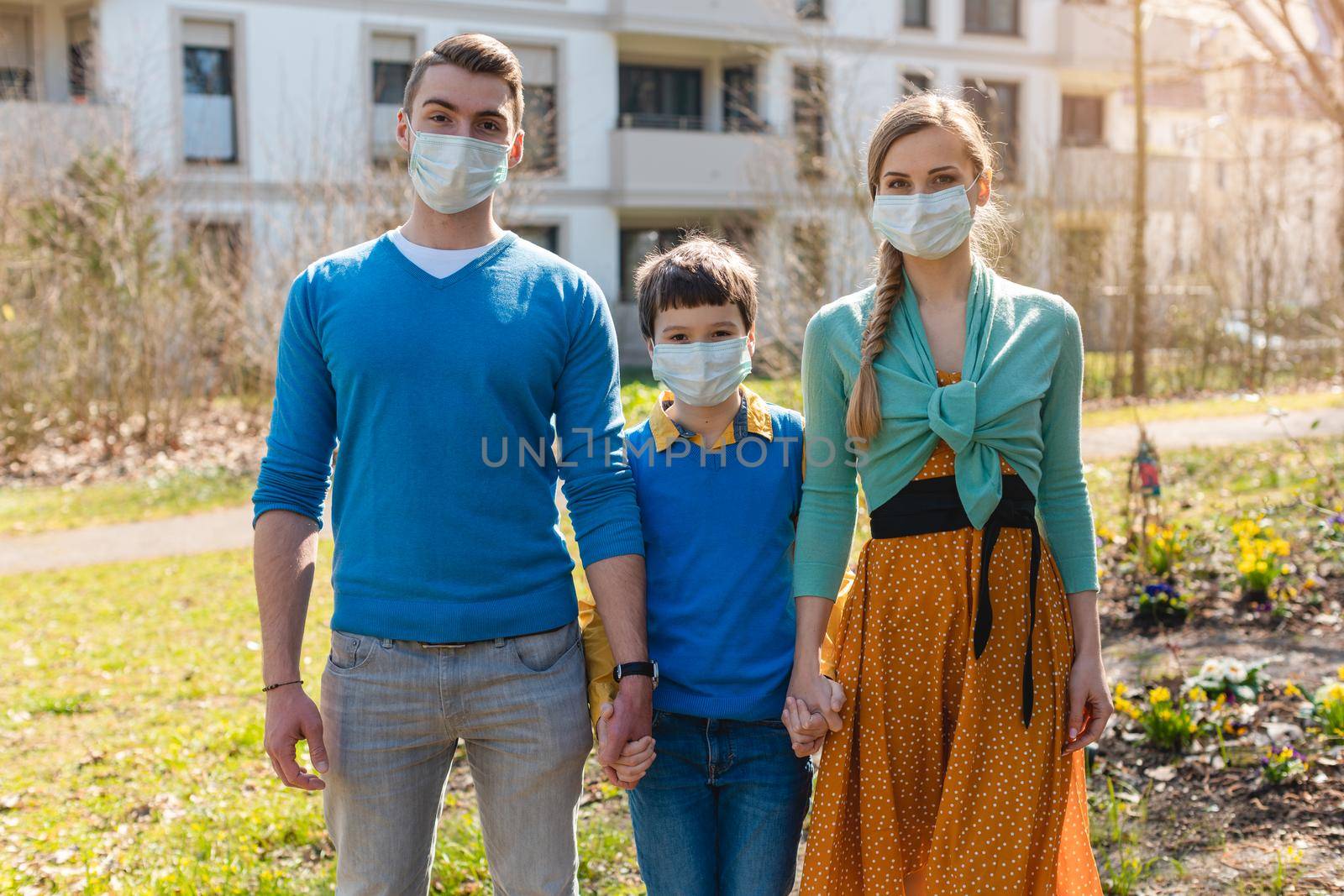 Family during coronavirus crises having a walk by Kzenon