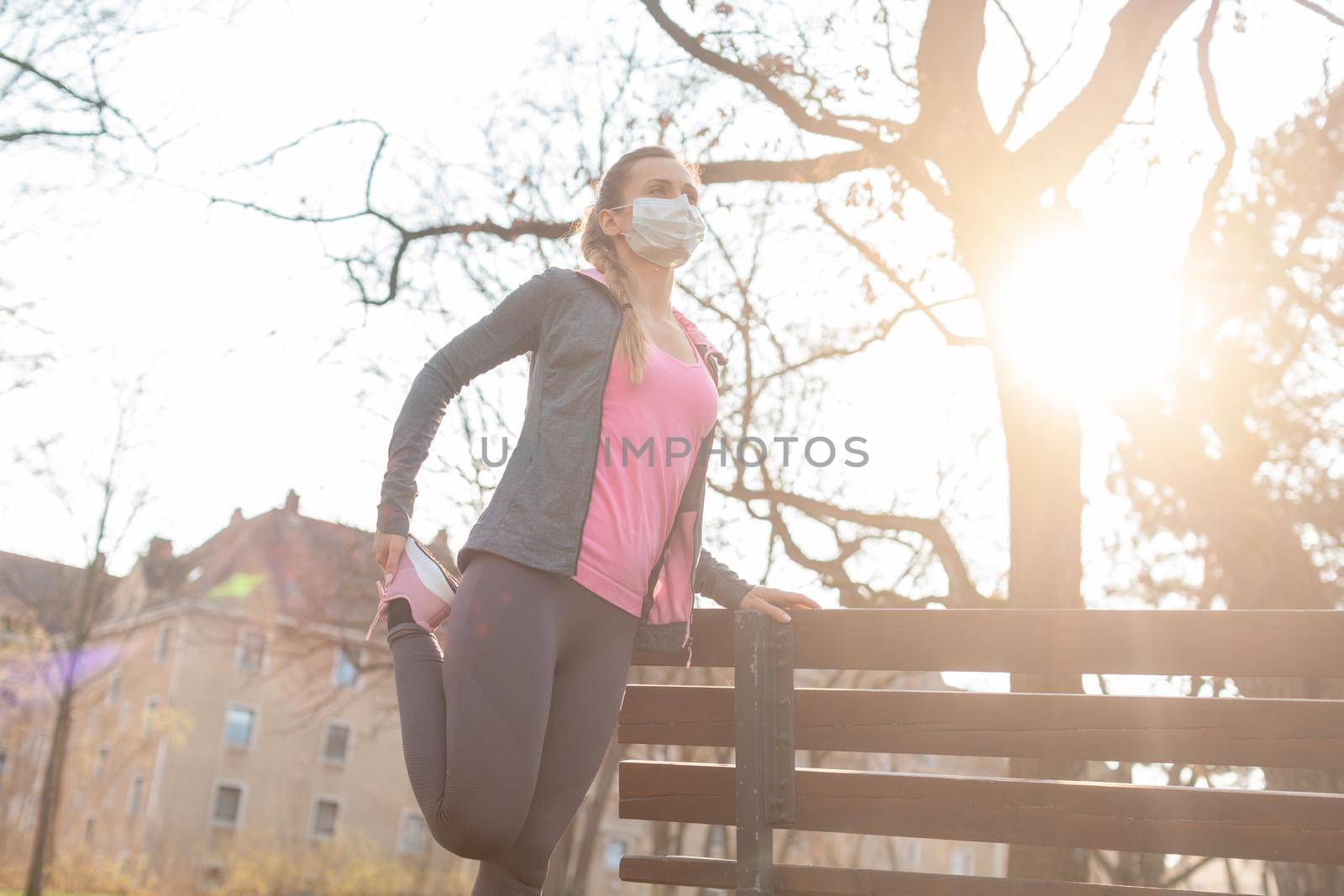 Woman during coronavirus crises exercising outdoors in park