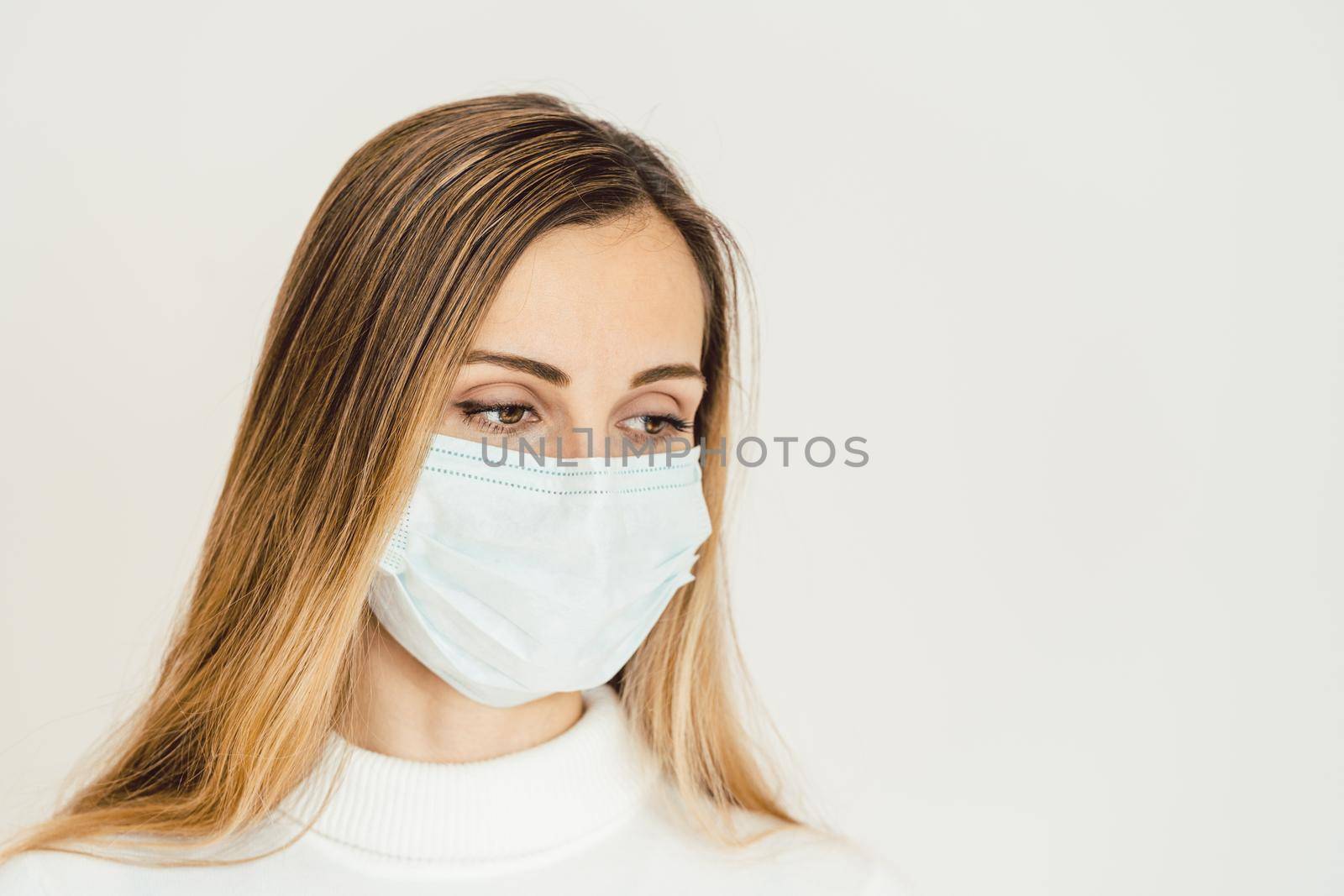 Woman contemplating what lies ahead during Coronavirus crisis being worried