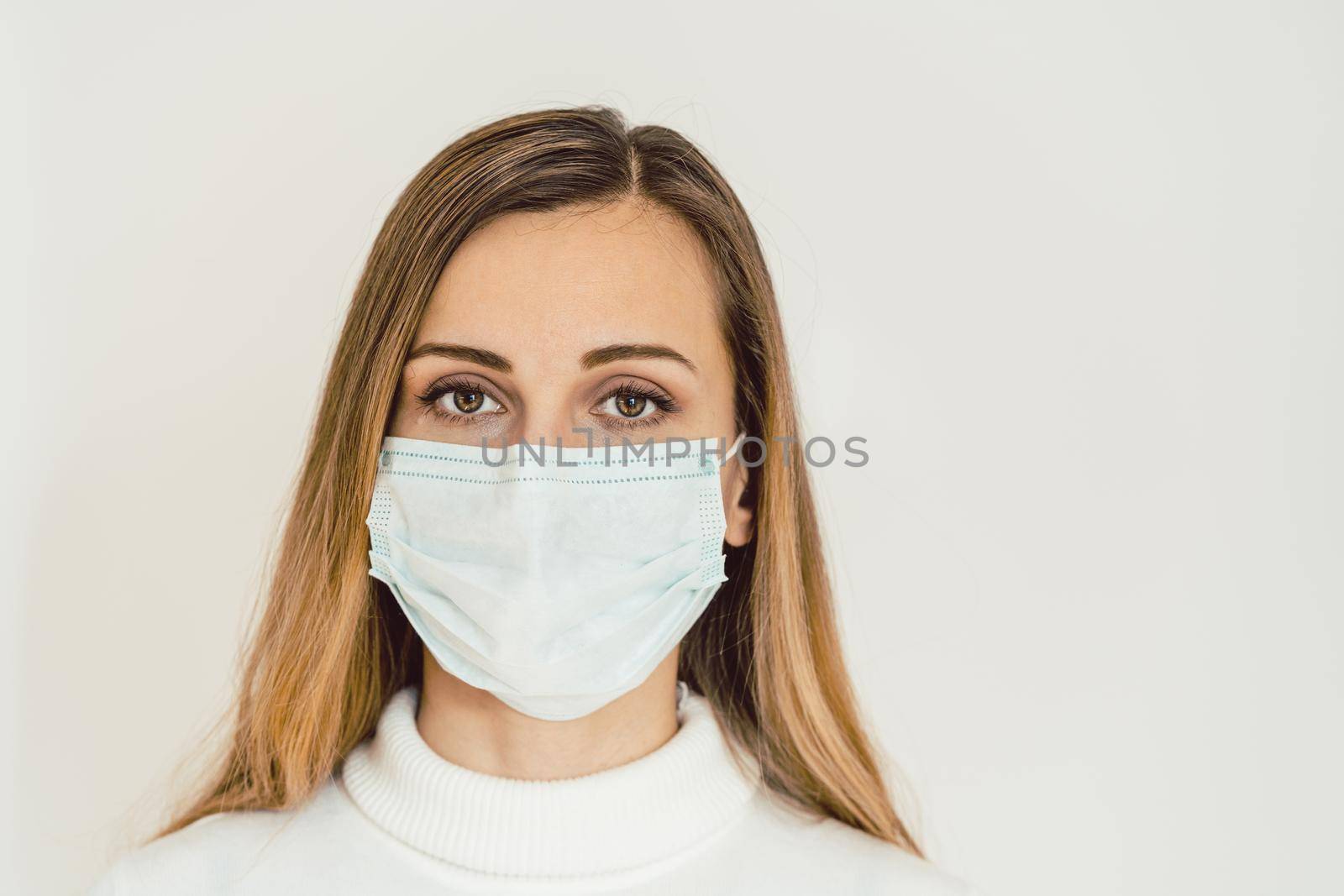 Worried woman during Covid-19 crisis in quarantine looking at camera