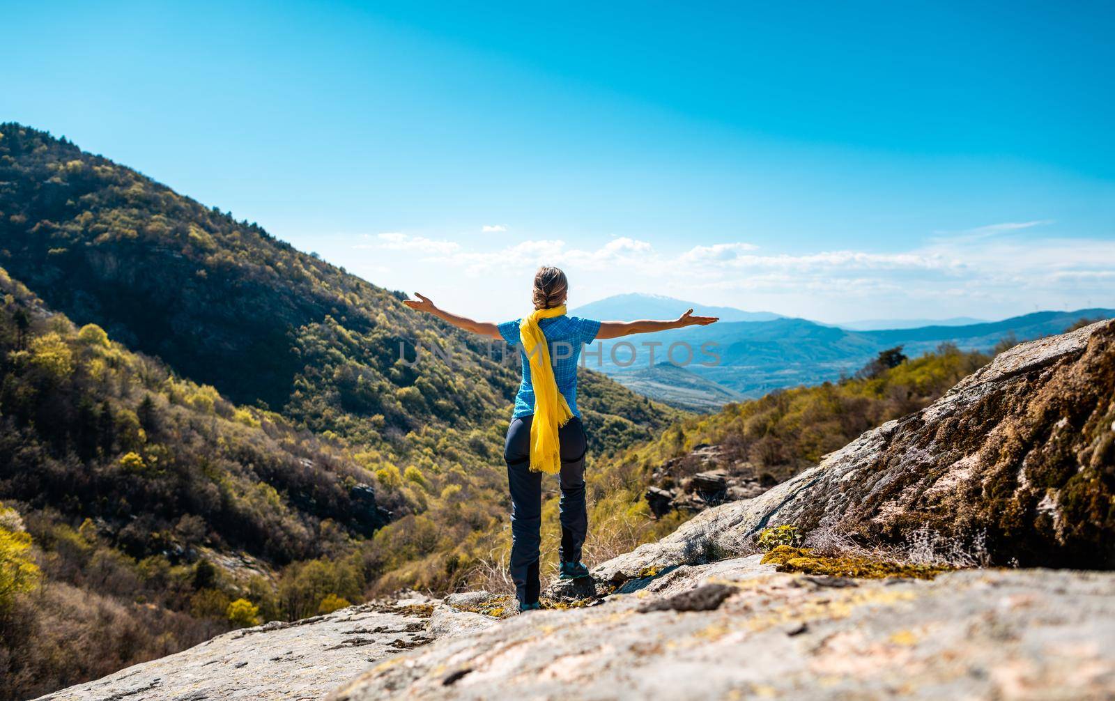 Hiking woman enjoying the freedom of a mountainous landscape near Serres, Greece