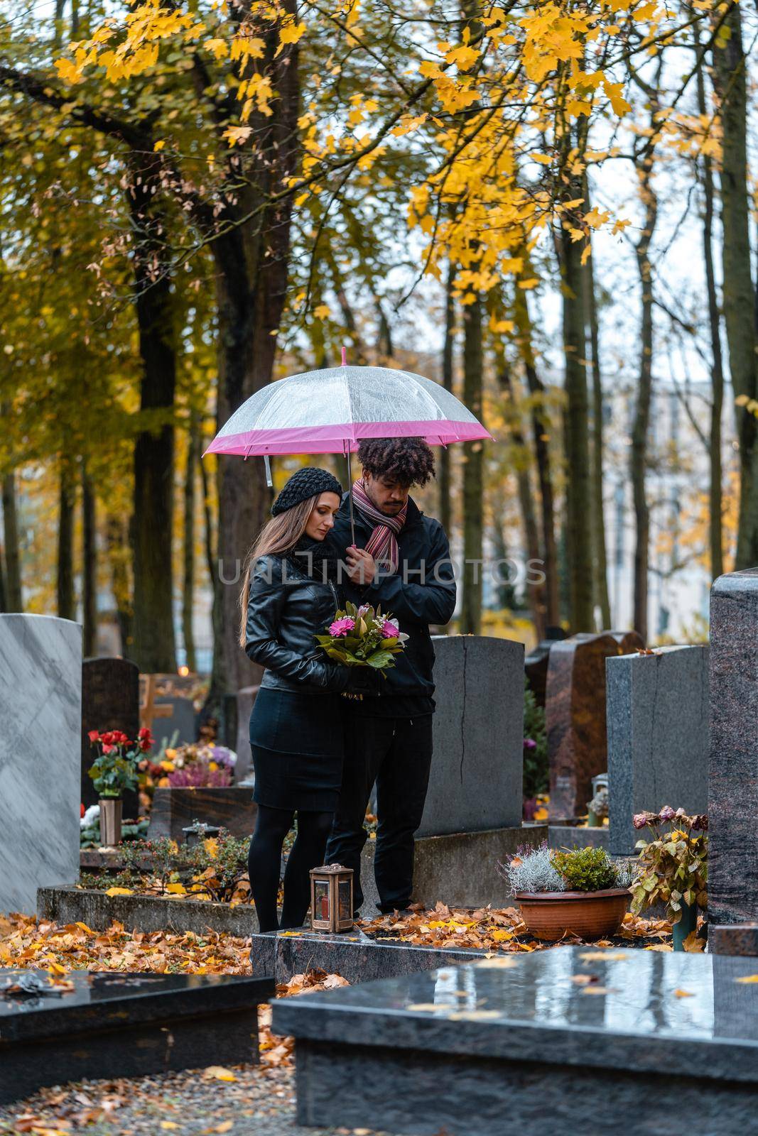 Man and woman on a cemetery with flowers by Kzenon