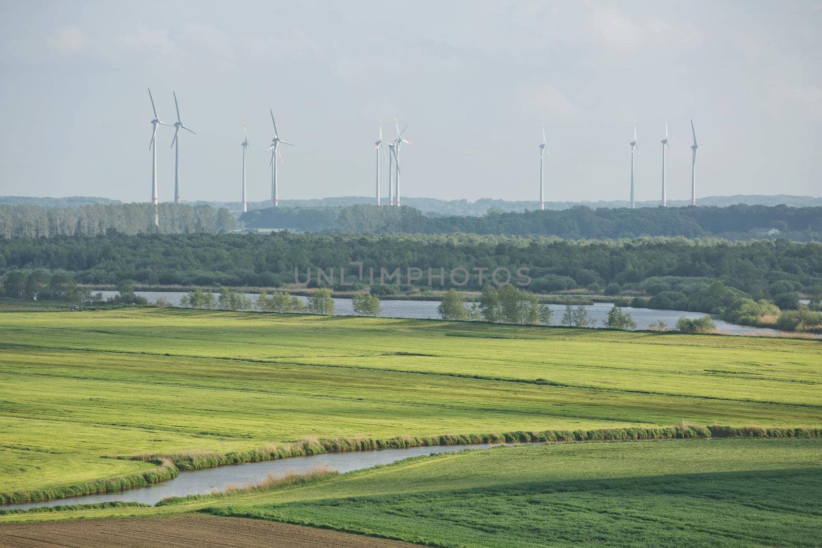 Beautiful countryside landscape with fields and windmills near Kiel - Schleswig-Holstein - Germany.