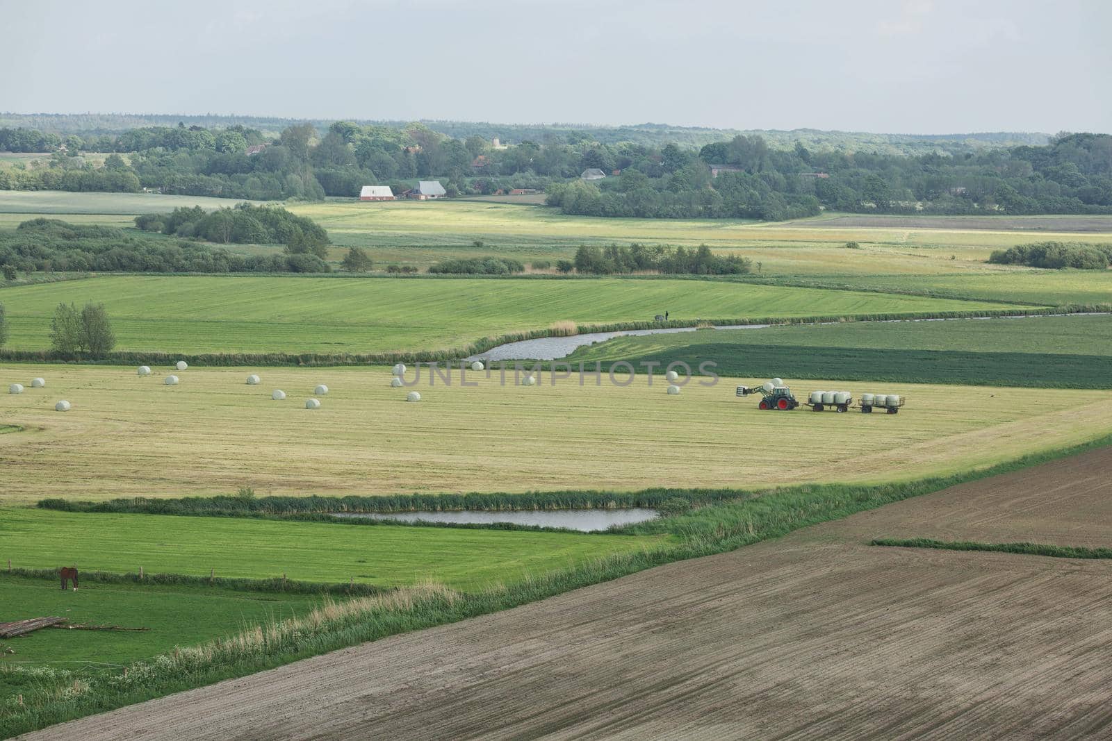 Beautiful countryside landscape with fields and small river near Kiel - Schleswig-Holstein - Germany.