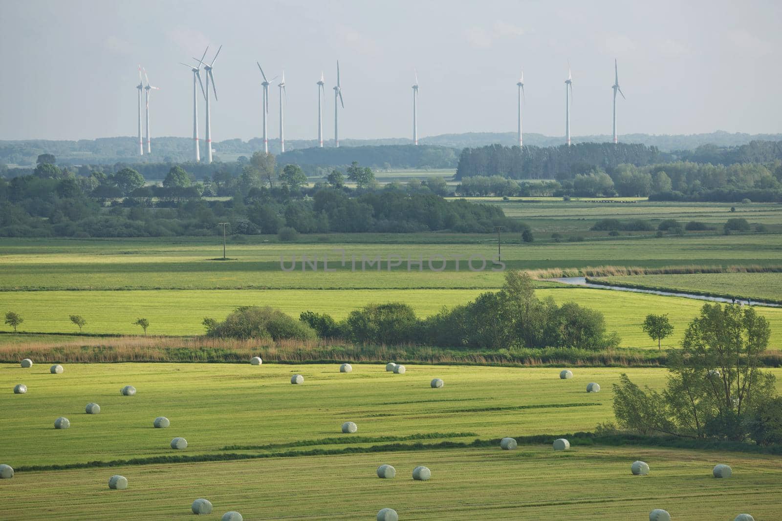 Beautiful countryside landscape with fields and windmills near Kiel - Schleswig-Holstein - Germany.