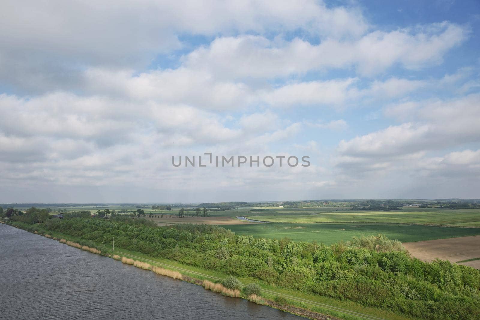 Beautiful countryside landscape with fields and small river near Kiel - Schleswig-Holstein - Germany.