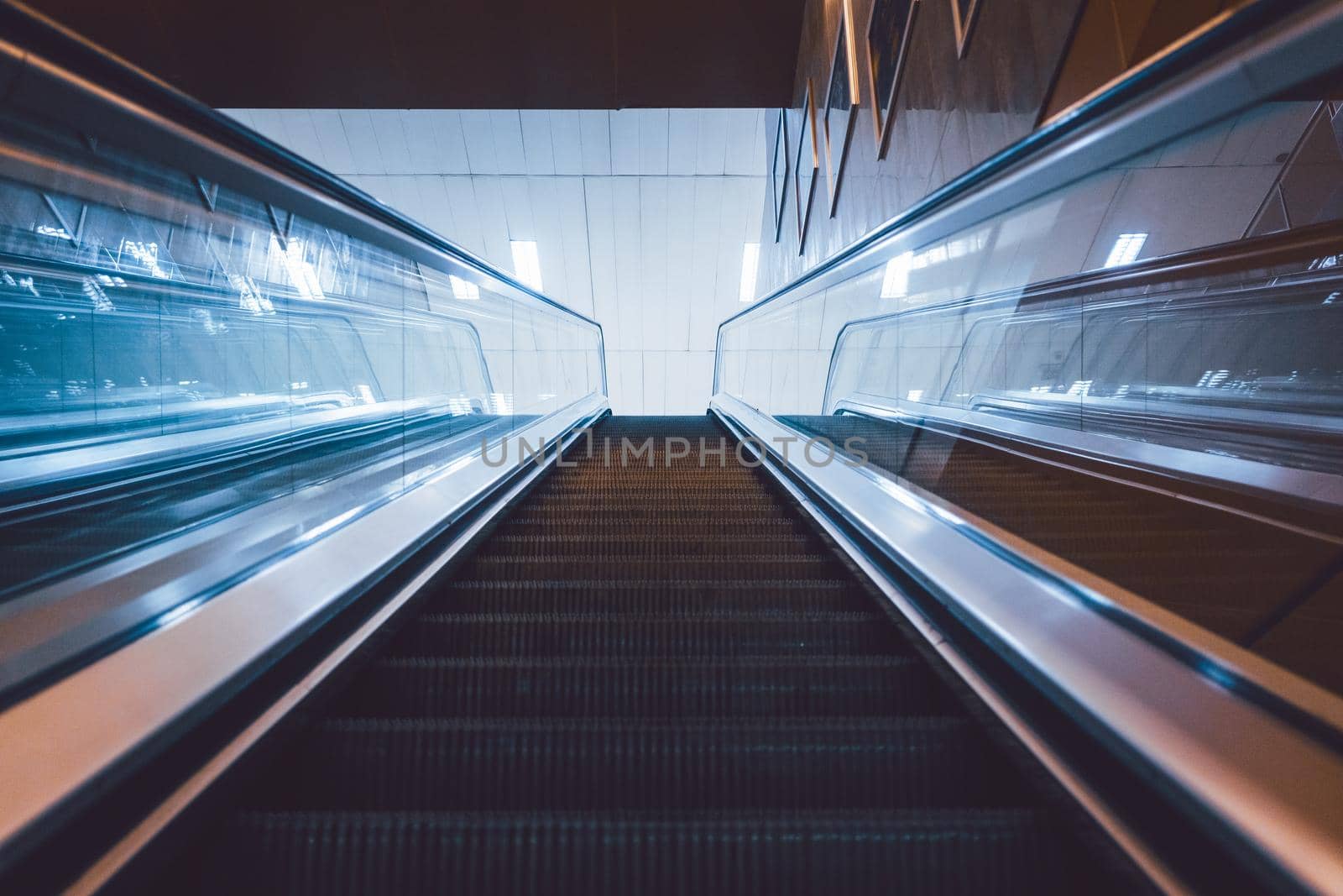 Escalator to the subway station in eerie light