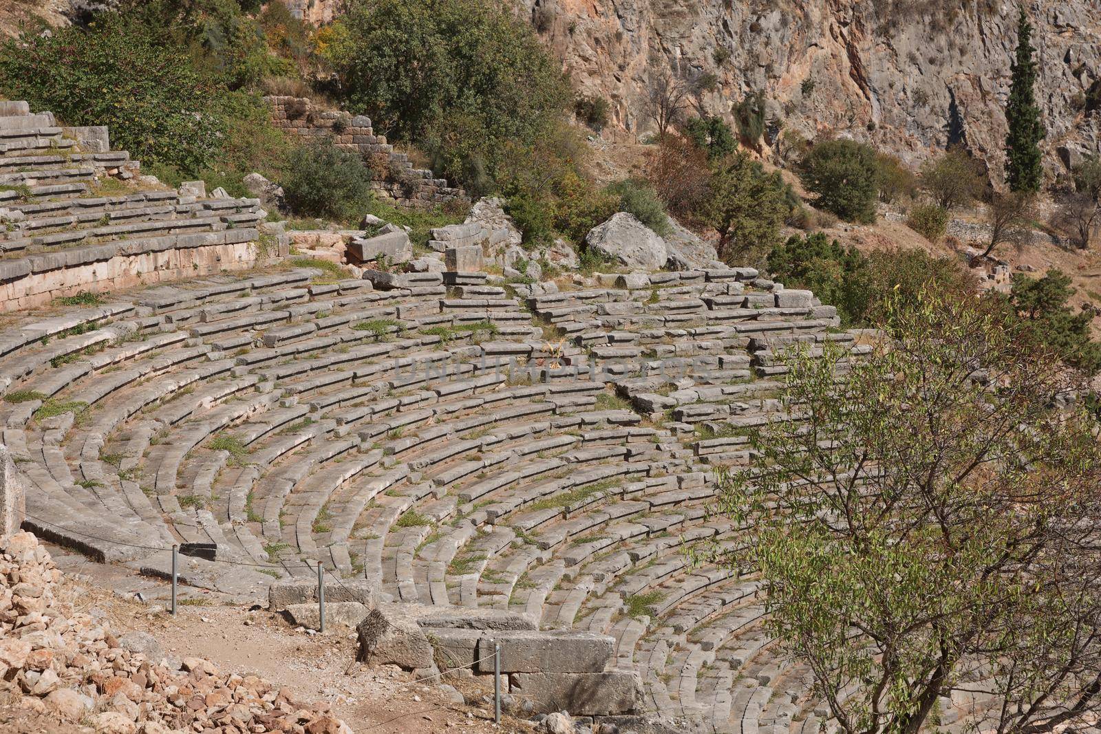 Panoramic view of Ancient Theater of Delphi, Phocis in Greece. The theater, with a total capacity of 5,000 spectators, is located at the sanctuary of Apollo. UNESCO World heritage.