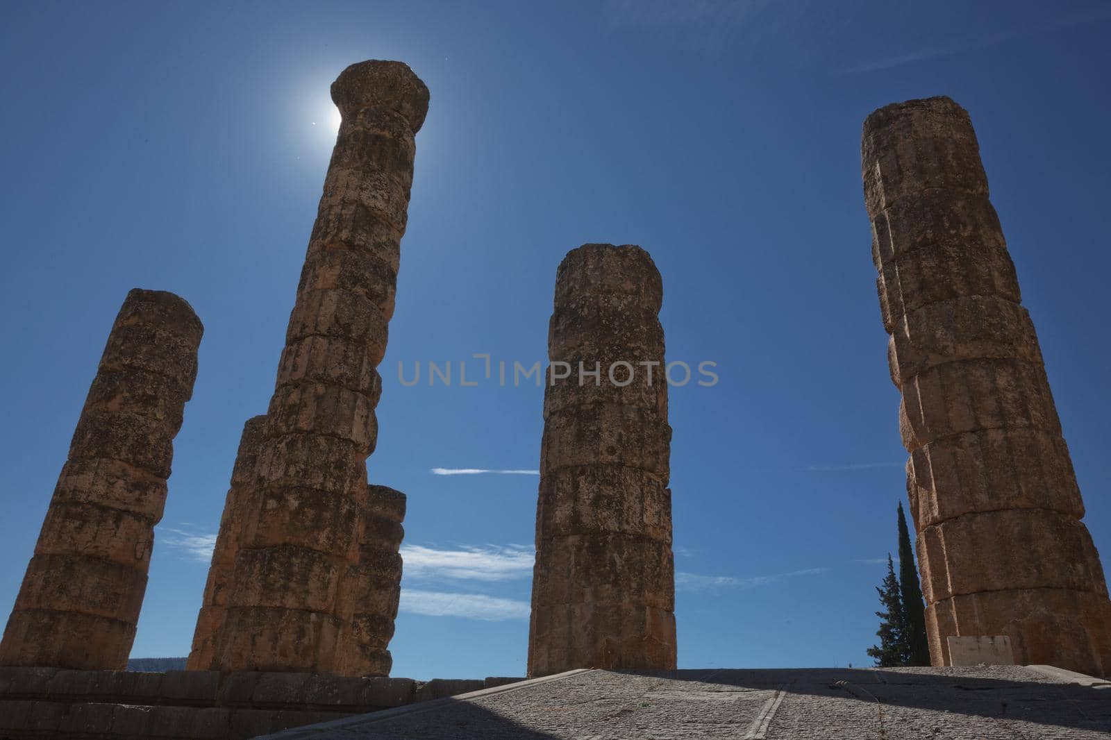 Apollo Temple in Delphi, an archaeological site in Greece, at the Mount Parnassus. Delphi is famous by the oracle at the sanctuary dedicated to Apollo. UNESCO World heritage.