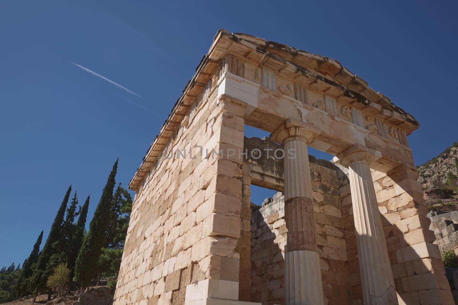 Athenian Treasure in Delphi, Greece, ancient sanctuary that grew rich as seat of oracle that was consulted on important decisions throughout ancient classical world. UNESCO World heritage.