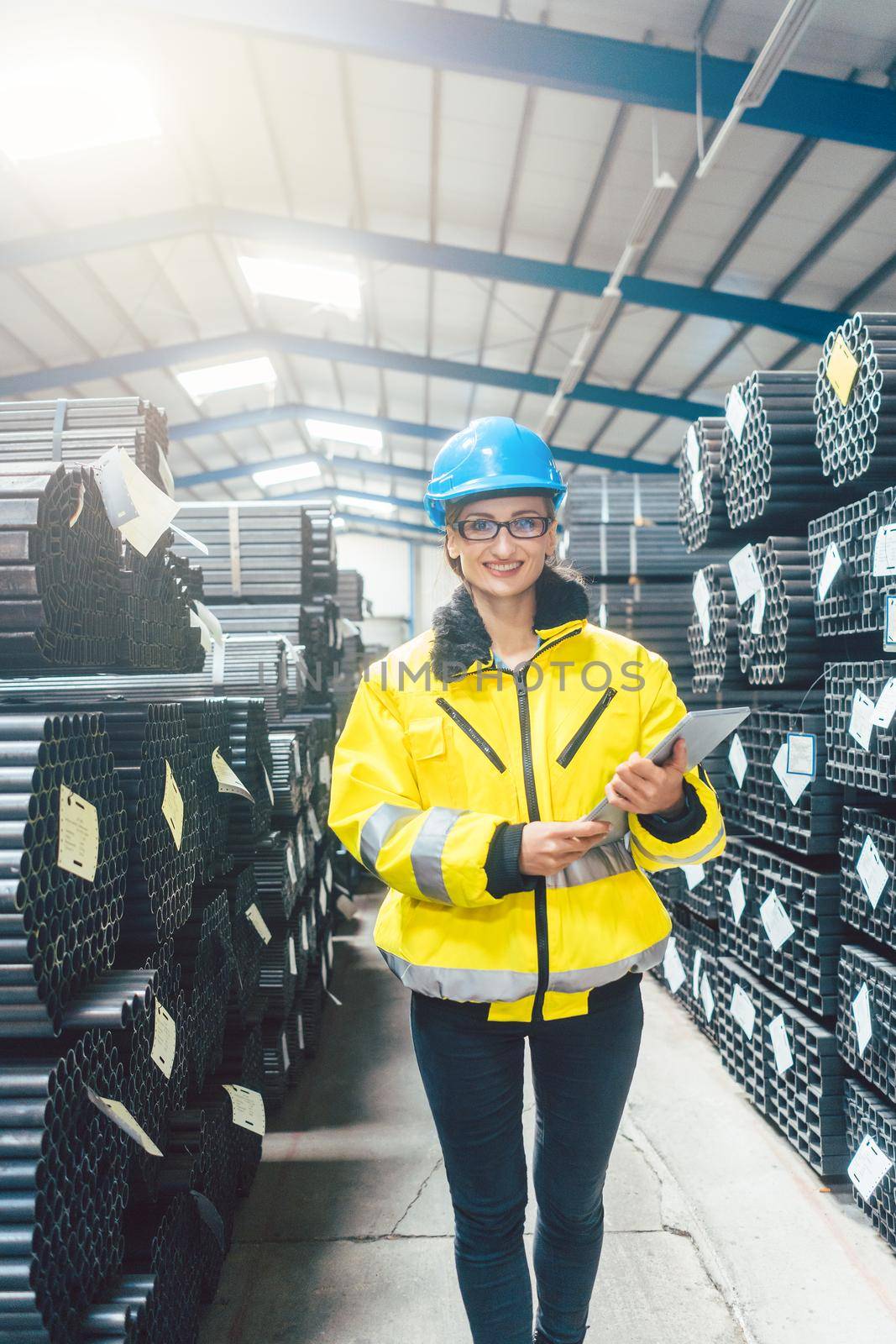 Woman working in logistics warehouse for building materials