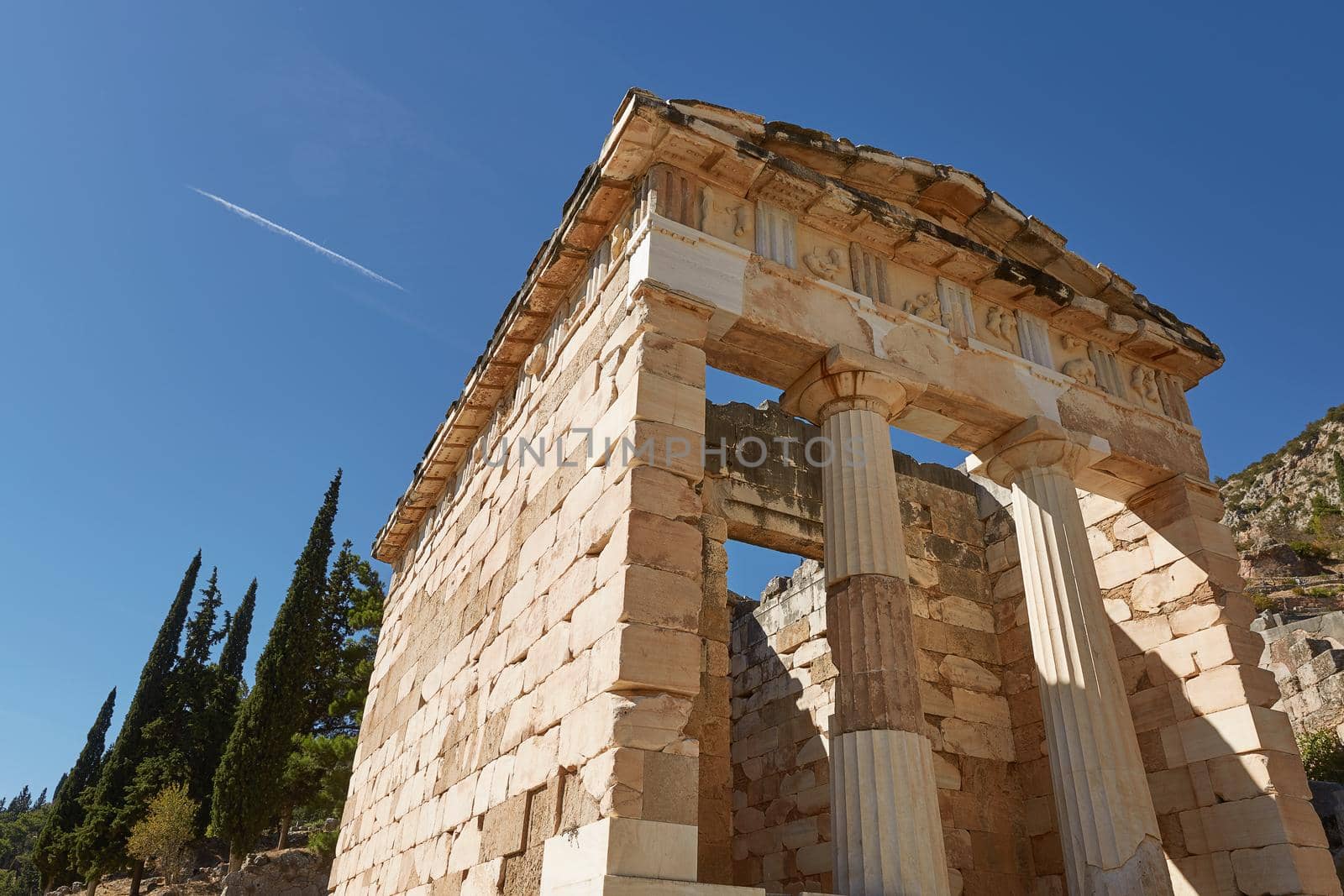 Low Angle View of The Athenian treasury in Delphi, Greece in a summer day