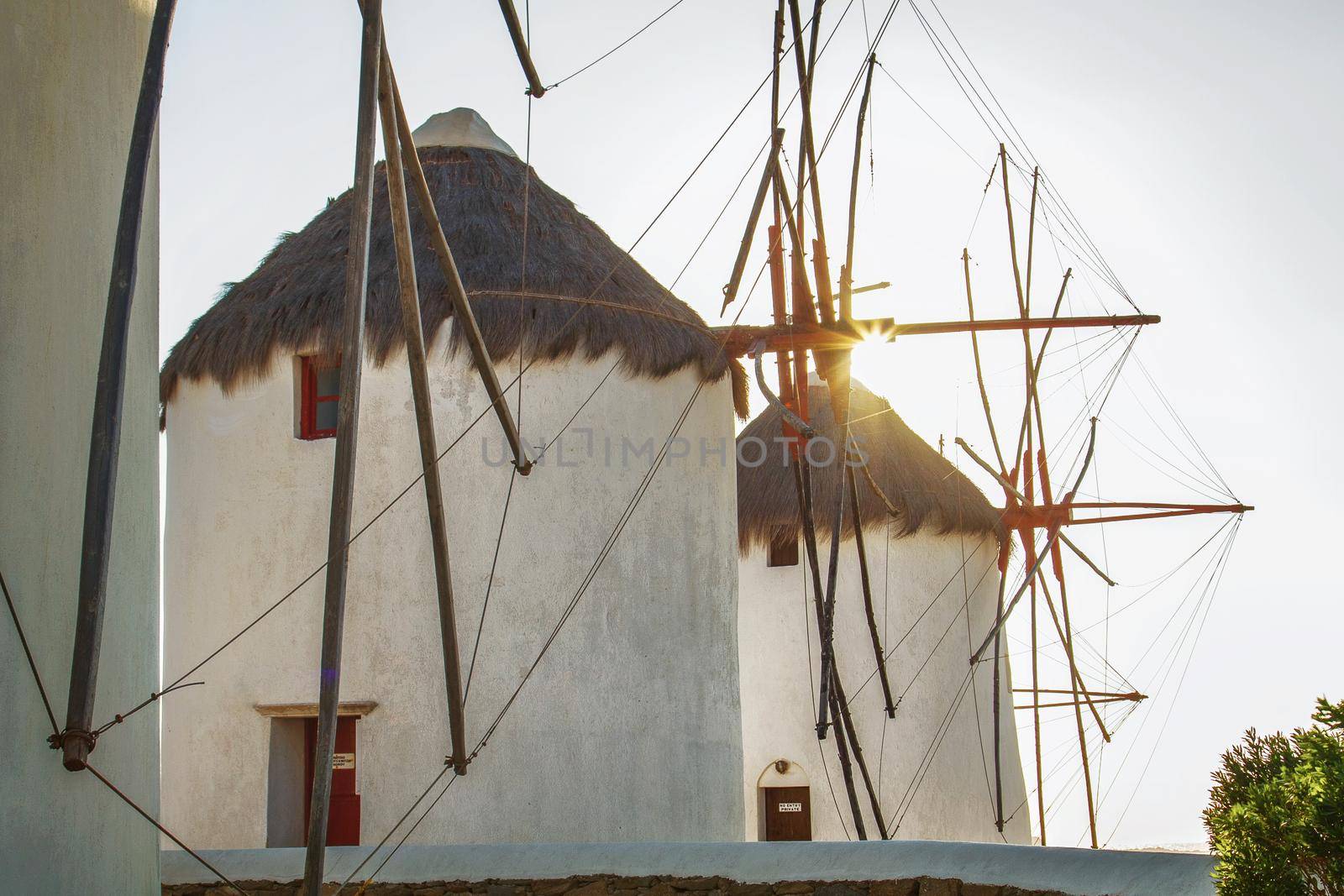 Windmills in Mykonos Greece Backlit by Sun