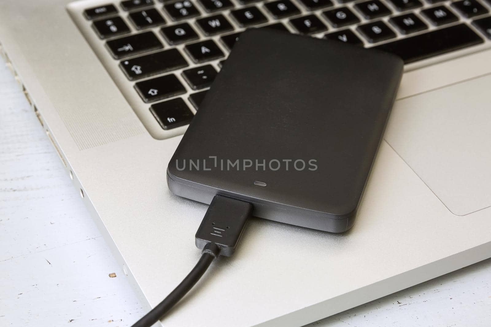 External Hard Disk Over Laptop Keyboard.