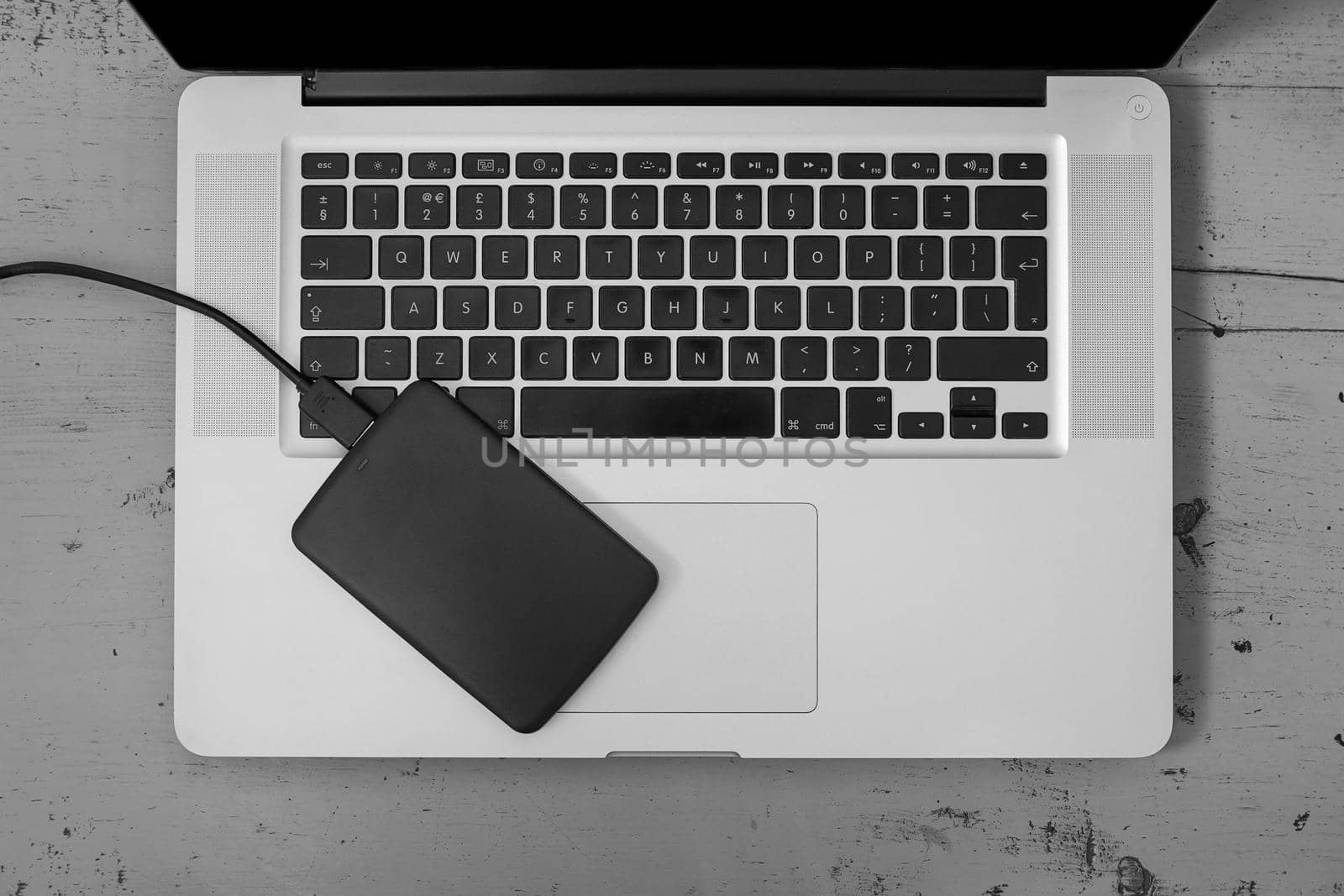 External Hard Disk Over Laptop Keyboard.