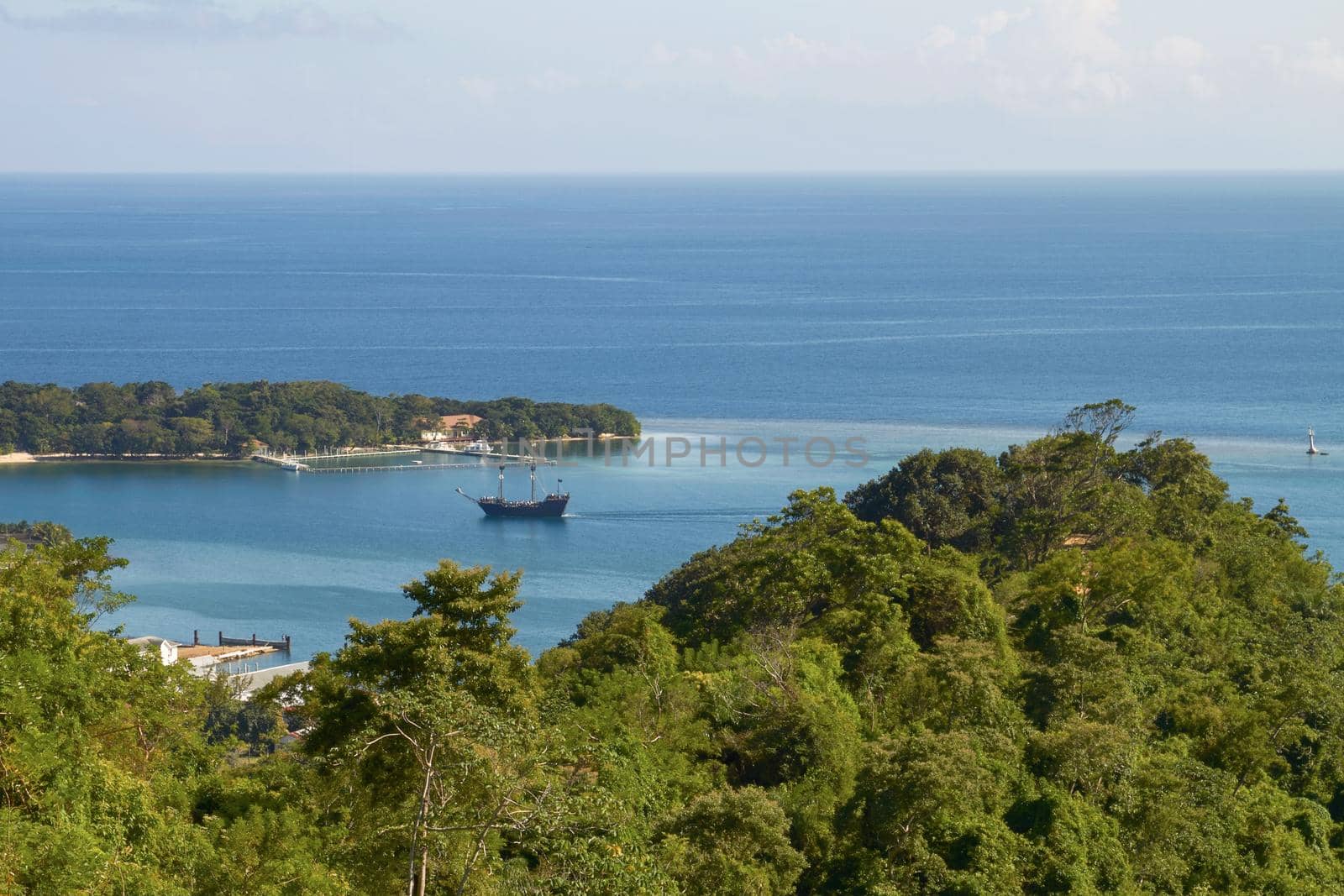 View of a Bay and laguna with a boat in Roatan in Honduras.