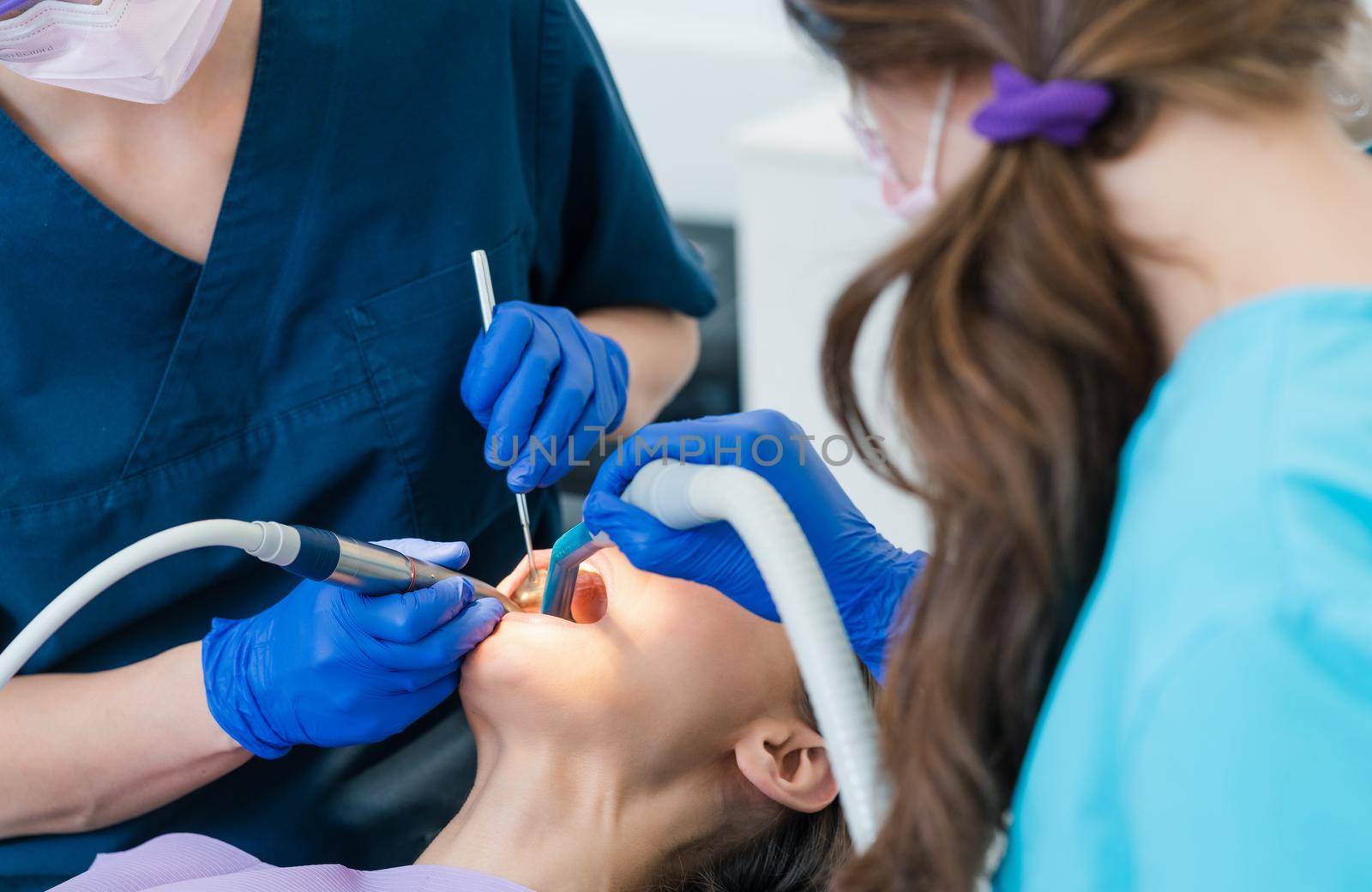 Woman in treatment at the dentists office, close-up