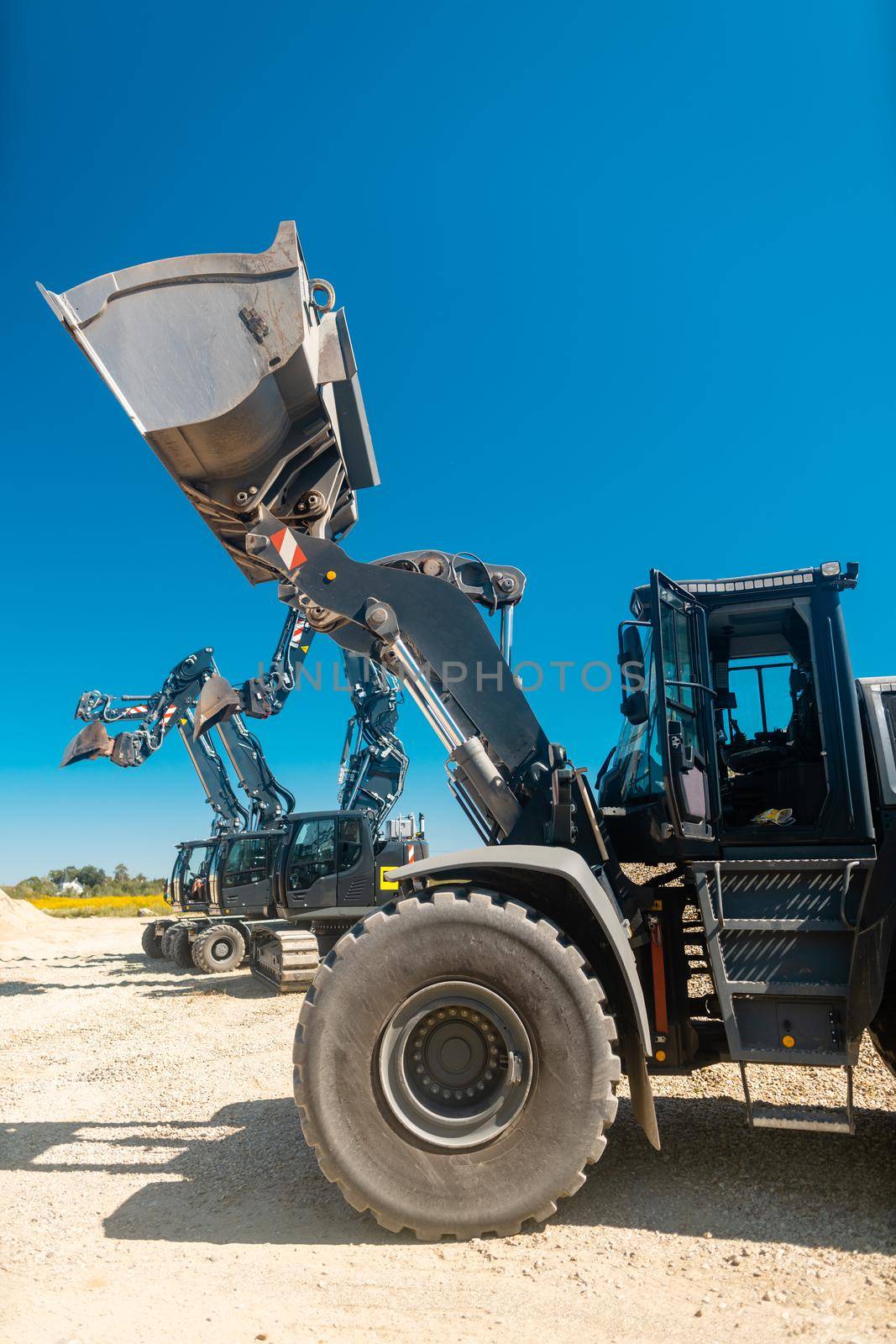 Excavator standing in industrial sand pit ready for work