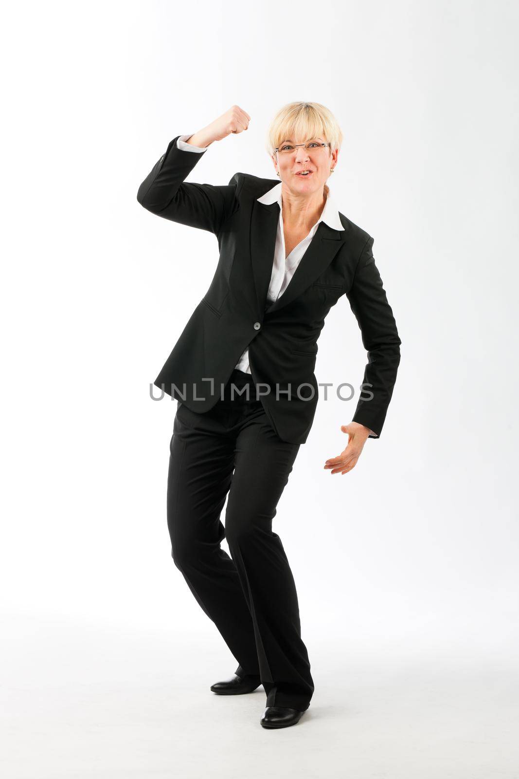 Blonde mature businesswoman celebrating her success against white background