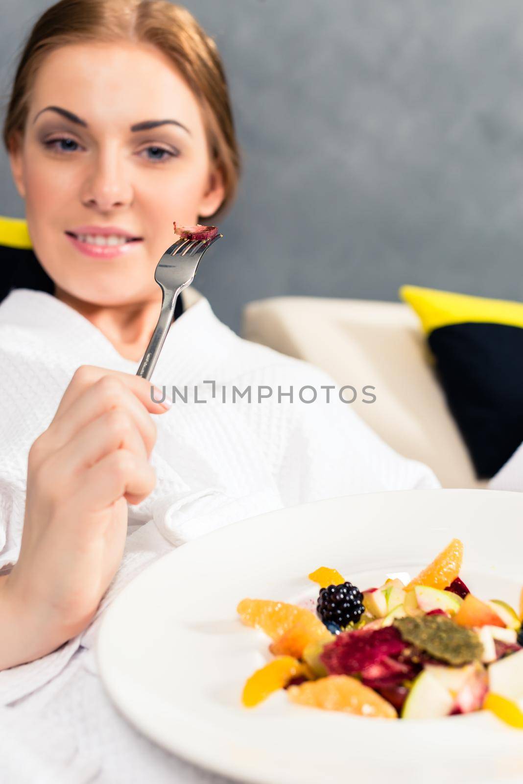 Portrait of a smiling woman eating healthy food