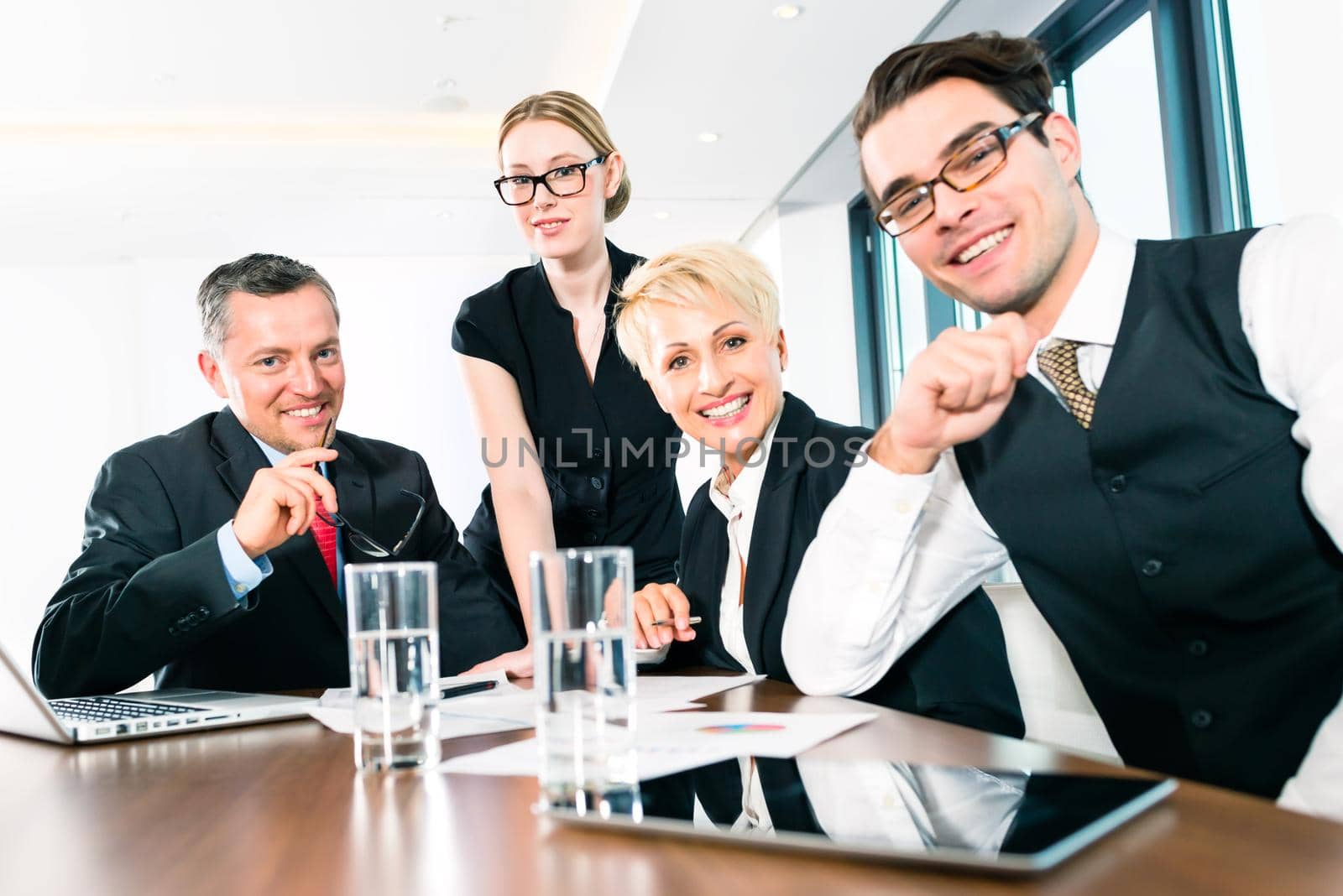 Group of happy successful business people in office