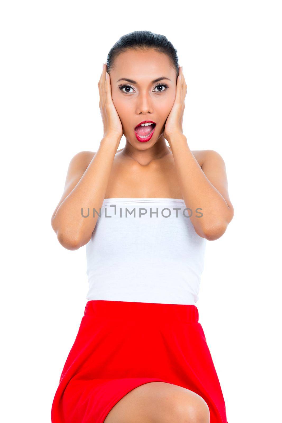 Portrait of a surprised woman on white background