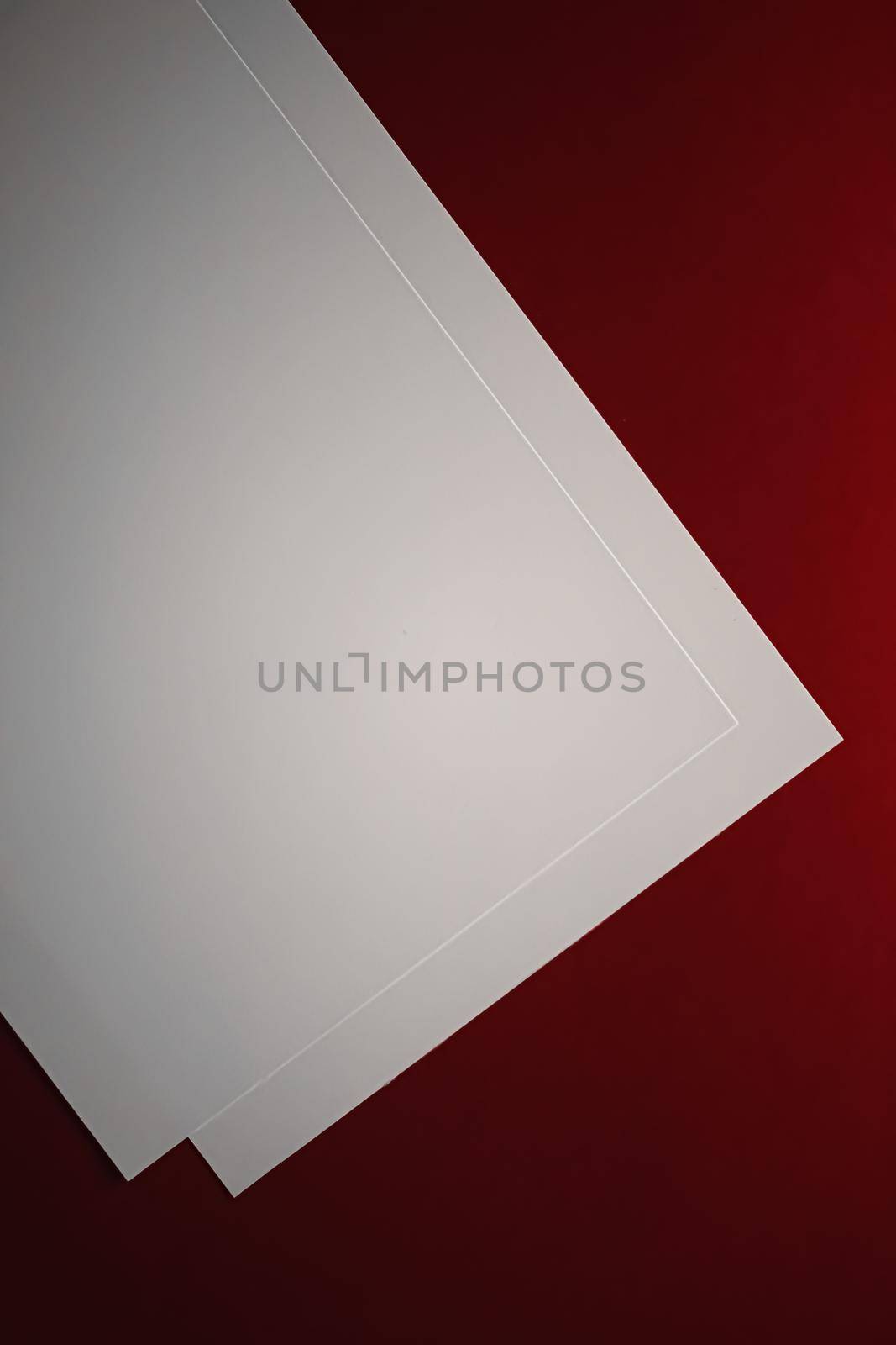 Blank A4 paper, white on red background as office stationery flatlay, luxury branding flat lay and brand identity design for mockup.