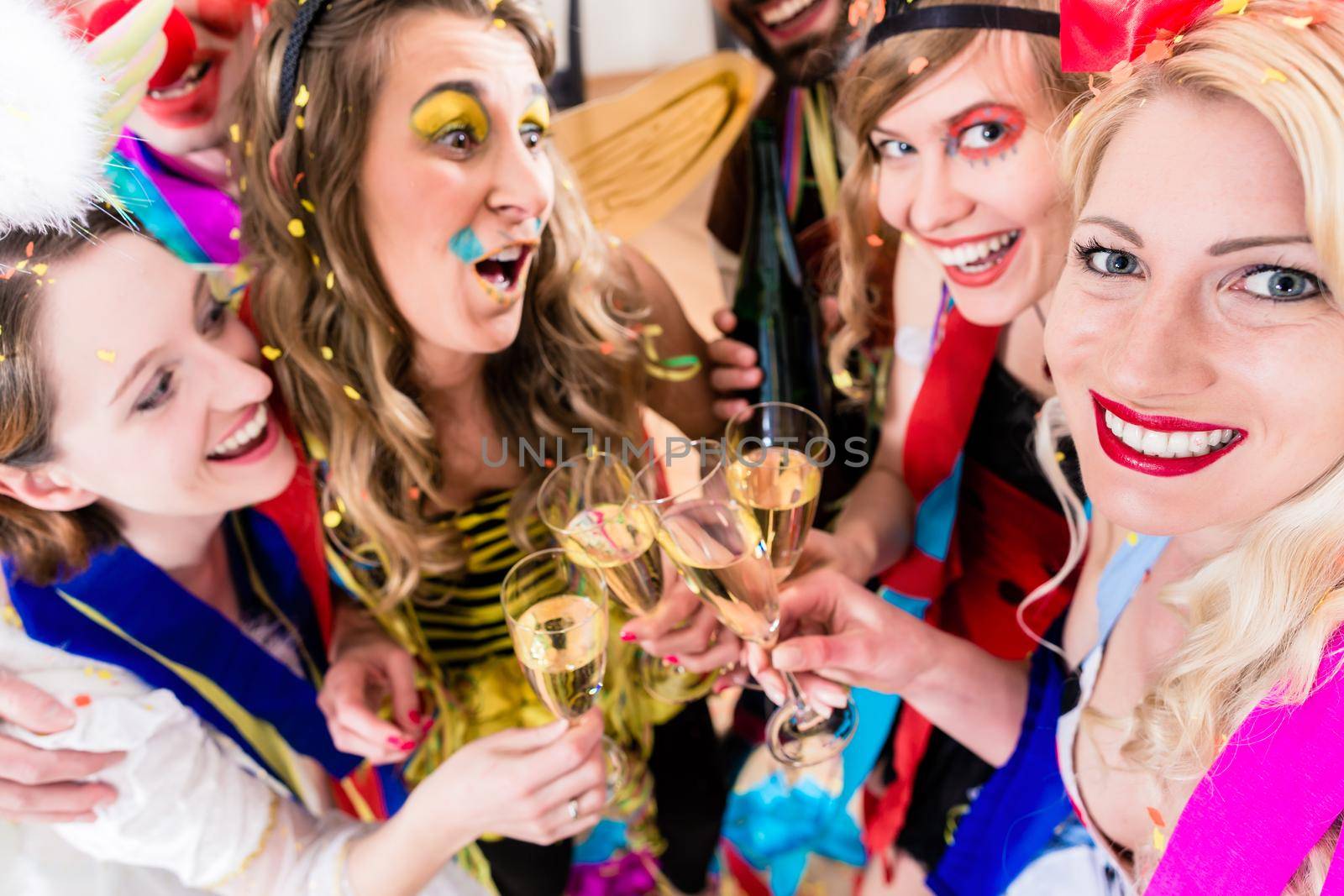 People on party drinking champagne by Kzenon