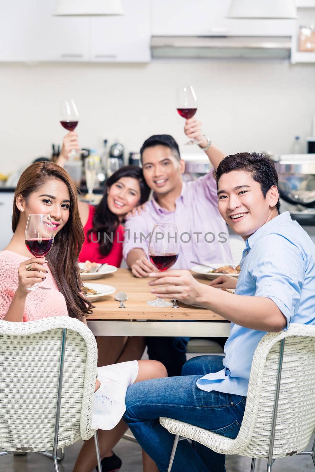 Group of friends enjoying the wine by Kzenon
