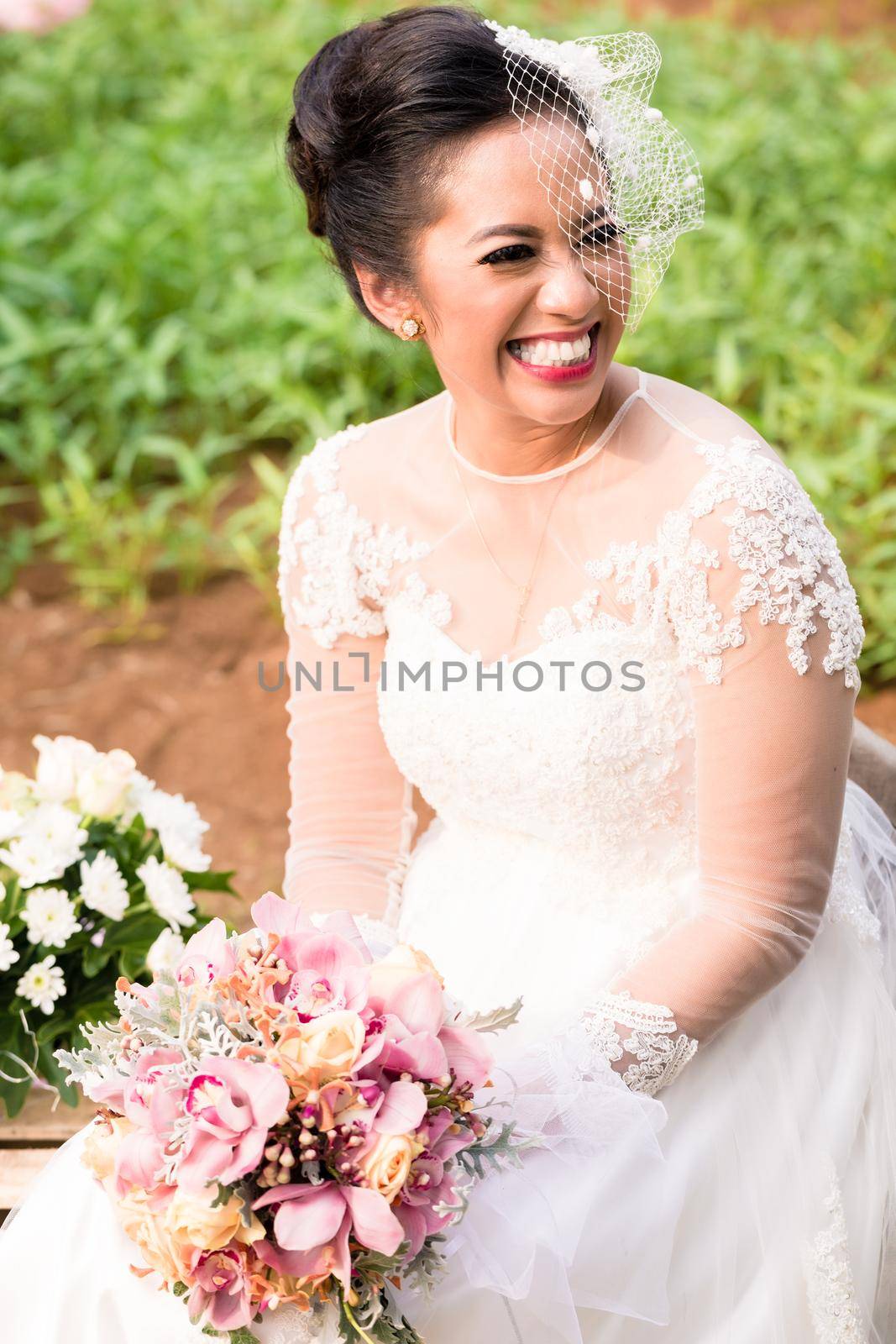 Happy Indonesian bride on her wedding