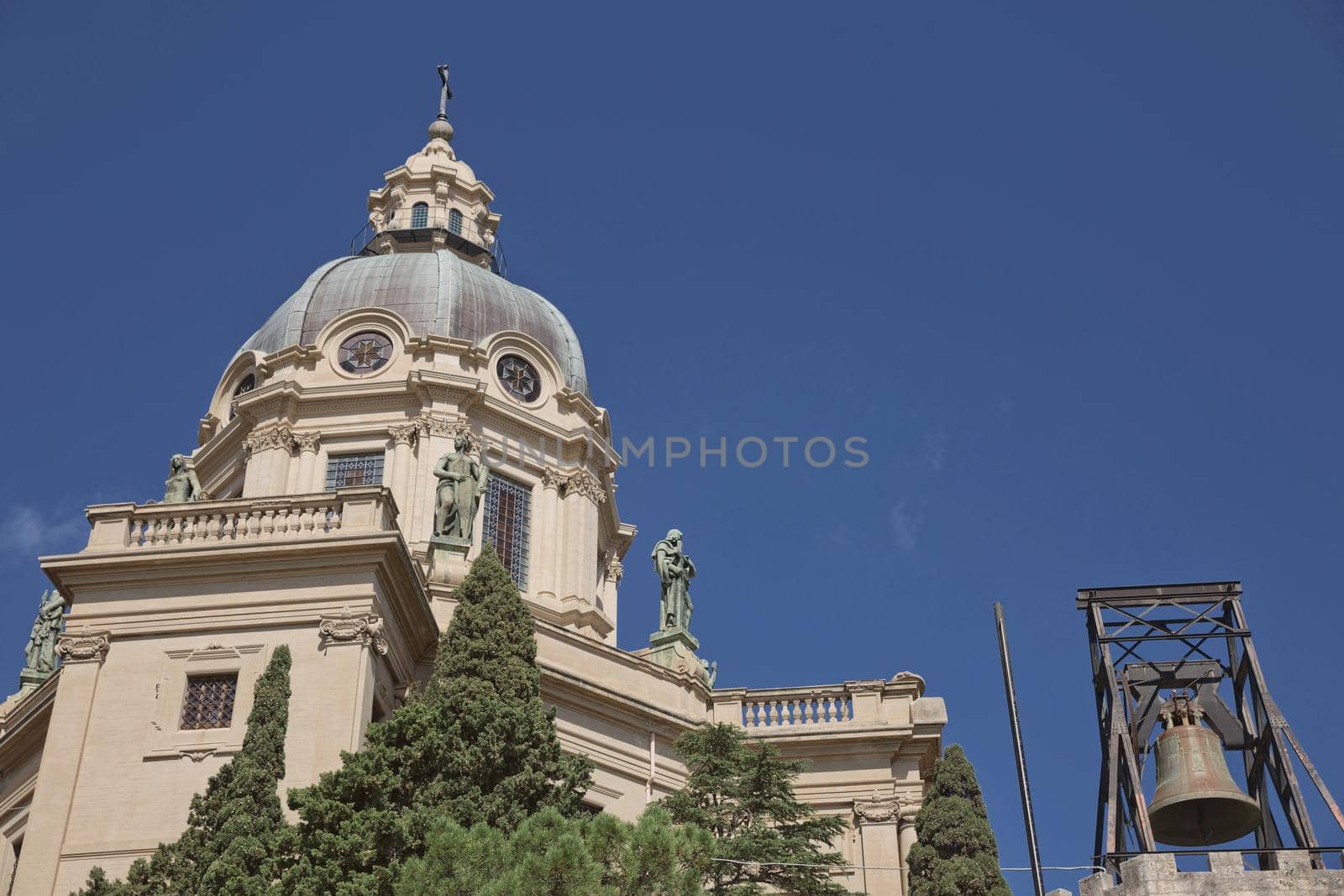 The dome of Church of King (Cristo Re) overlooking the city of Messina in Italy during summer. Beautiful photo of the landmark in Sicily.