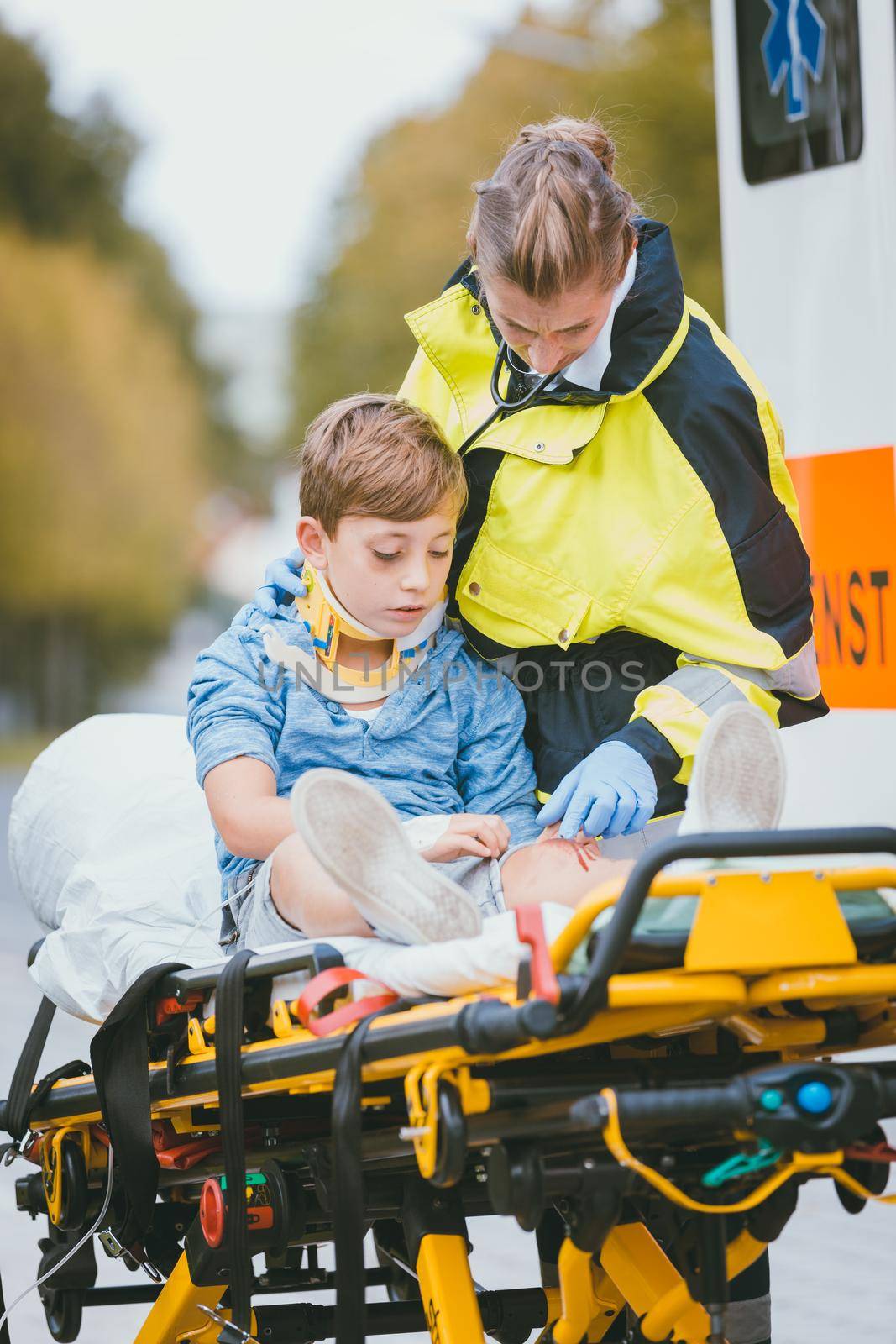 Emergency doctor giving oxygen to accident victim, a child
