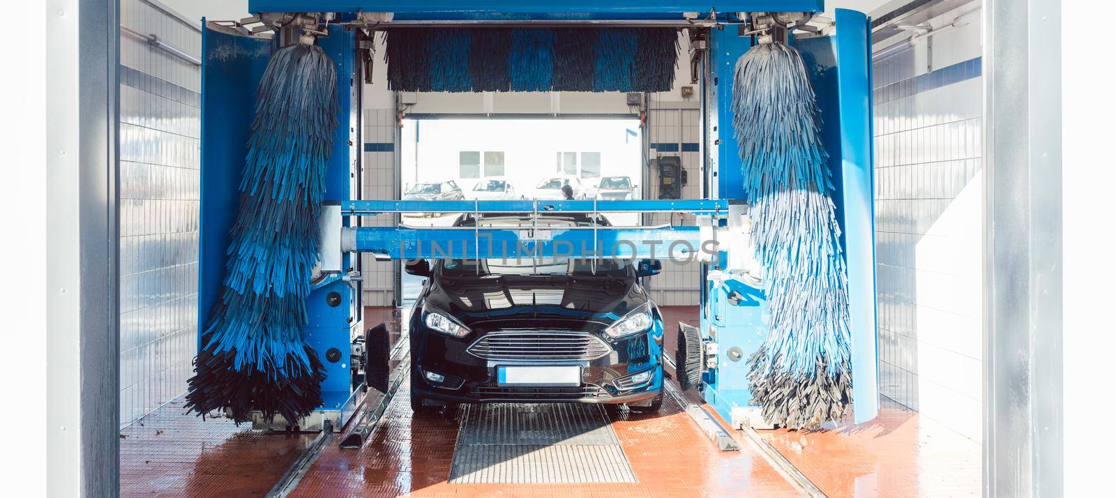 Brush turning in car wash with vehicle in it by Kzenon