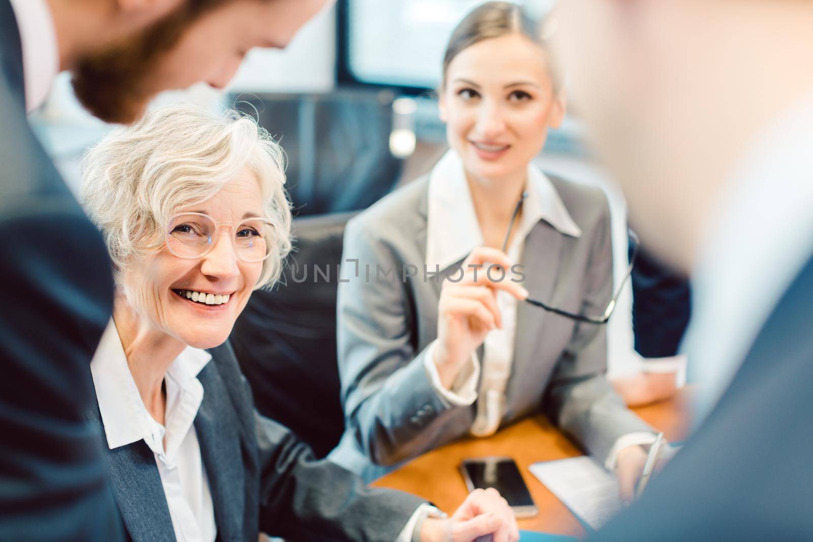 Business people during negotiation of an agreement discussing the terms