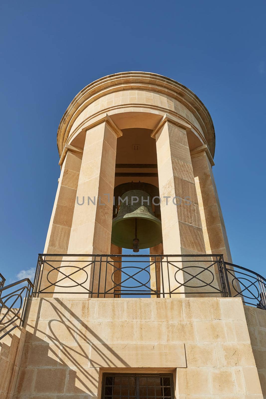 World War II Siege Bell War Memorial from lower viewpoint in the Lower Barrakka Gardens, Valletta, Malta.