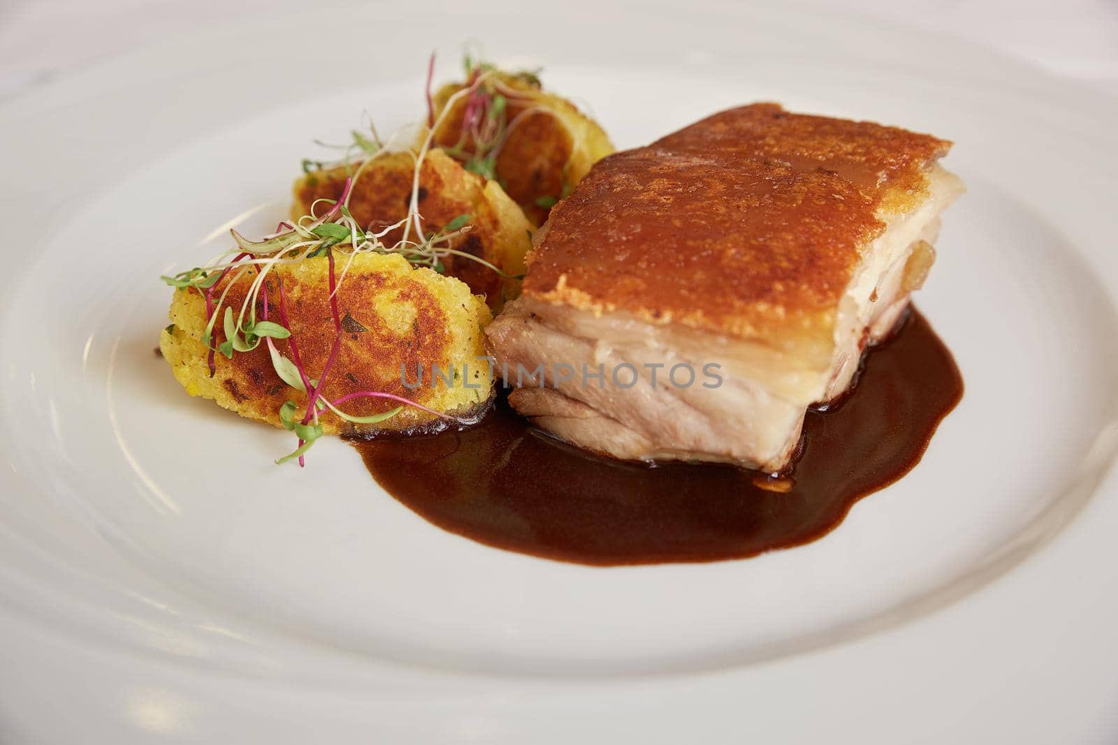 Traditional Peruvian Meal Called Chicharron de Panceta de Cerdo Served in a Restaurant.