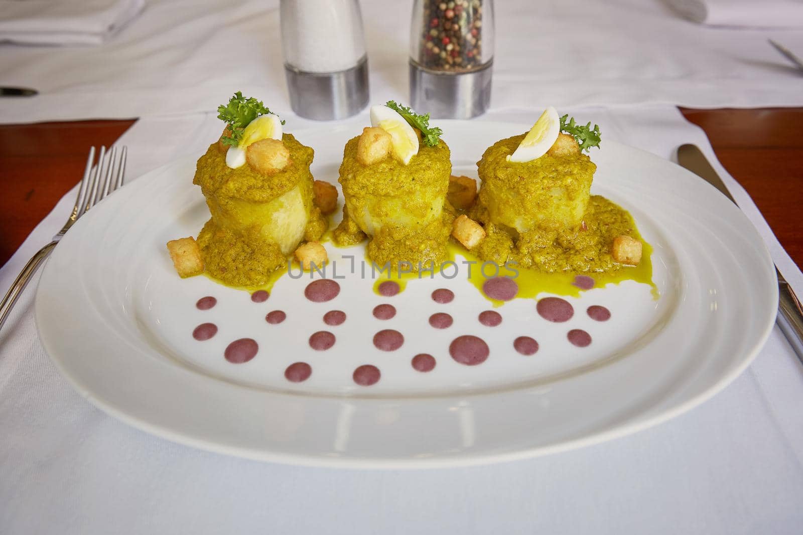 Traditional Peruvian Meal Called Ocopa Arequipena Served in a Restaurant.