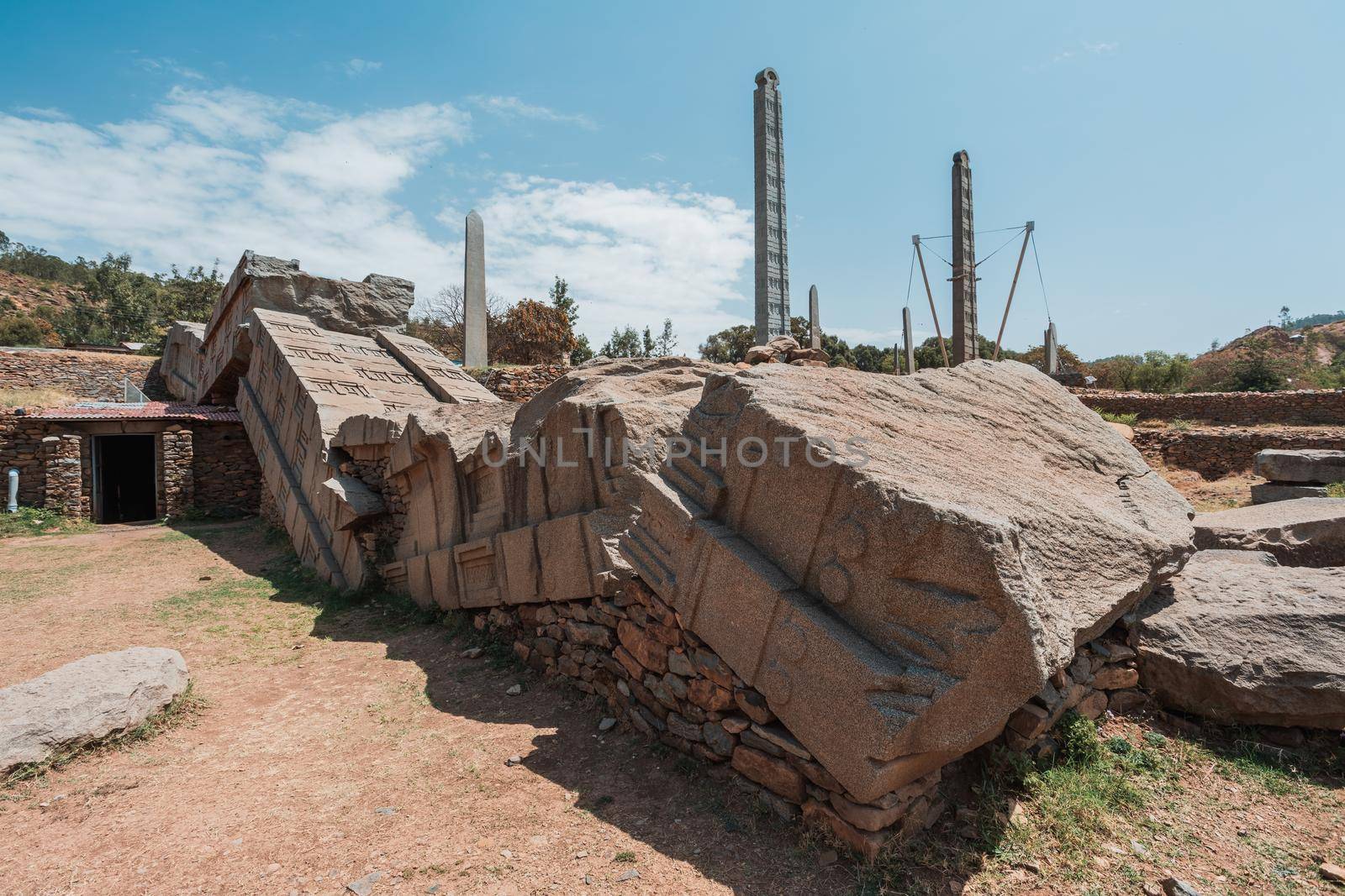 Aksumite civilization ruins, Ancient monolith stone obelisks behind Church of Our Lady of Zion, symbol of the Aksum, Ethiopia. UNESCO World Heritage site.