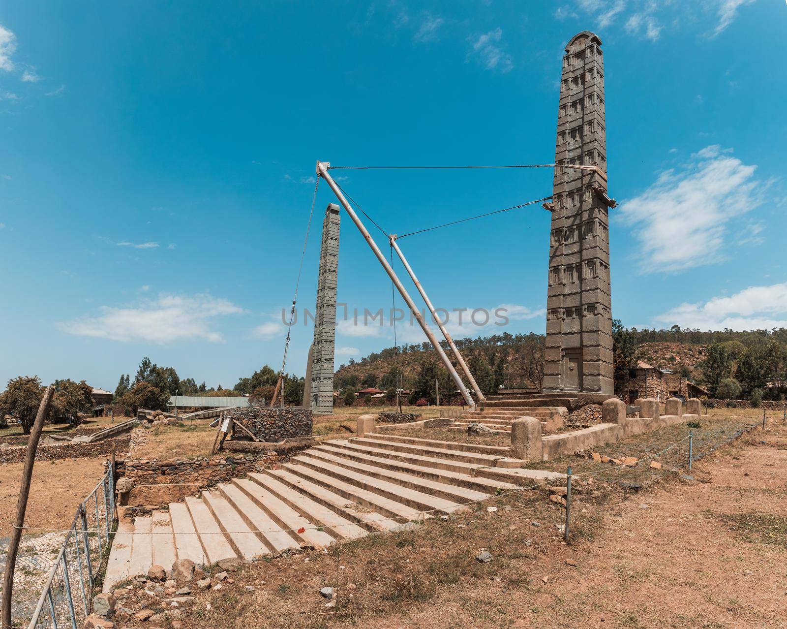 Aksumite civilization ruins, Ancient monolith stone obelisks behind Church of Our Lady of Zion, symbol of the Aksum, Ethiopia. UNESCO World Heritage site.