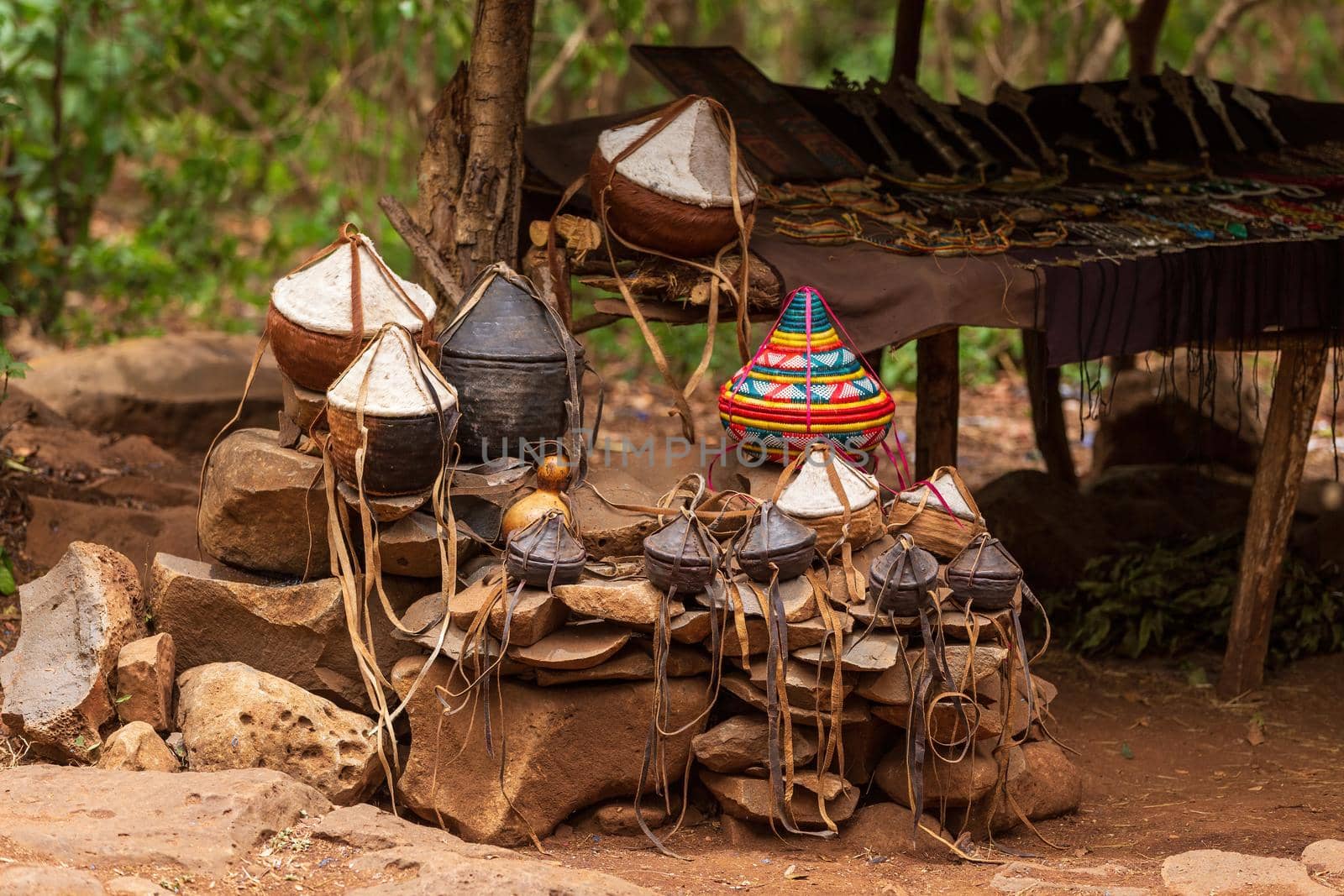 Souvenir shop next to the entrance to the ancient church Unesco Monastery Ura Kidane Mehret in Bahir Dar, Ethiopia. Traditional vintage leather handmade basket for food