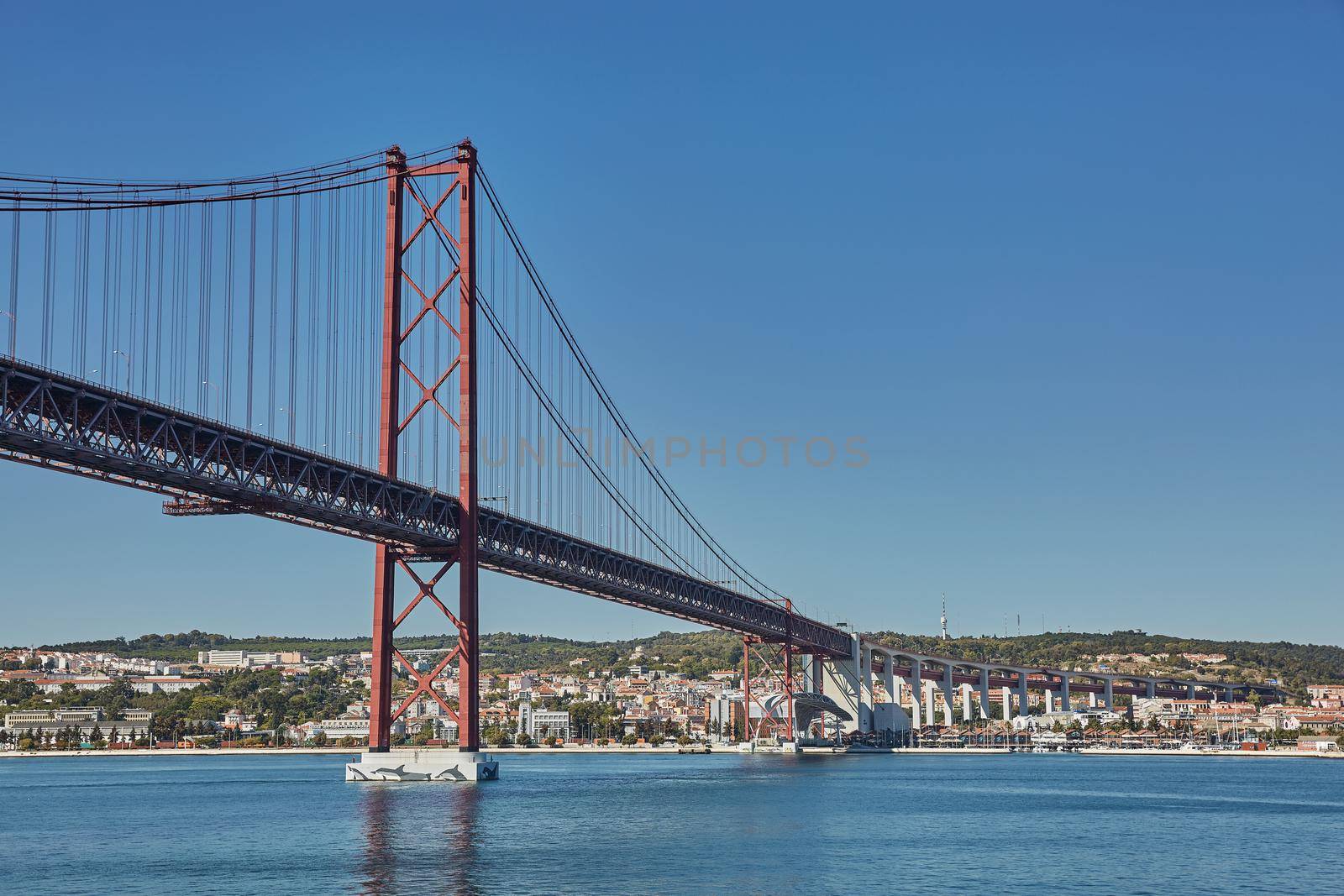 The 25 April bridge (Ponte 25 de Abril) is a steel suspension bridge located in Lisbon, Portugal, crossing the Tagus river. It is one of the most famous landmarks of the region