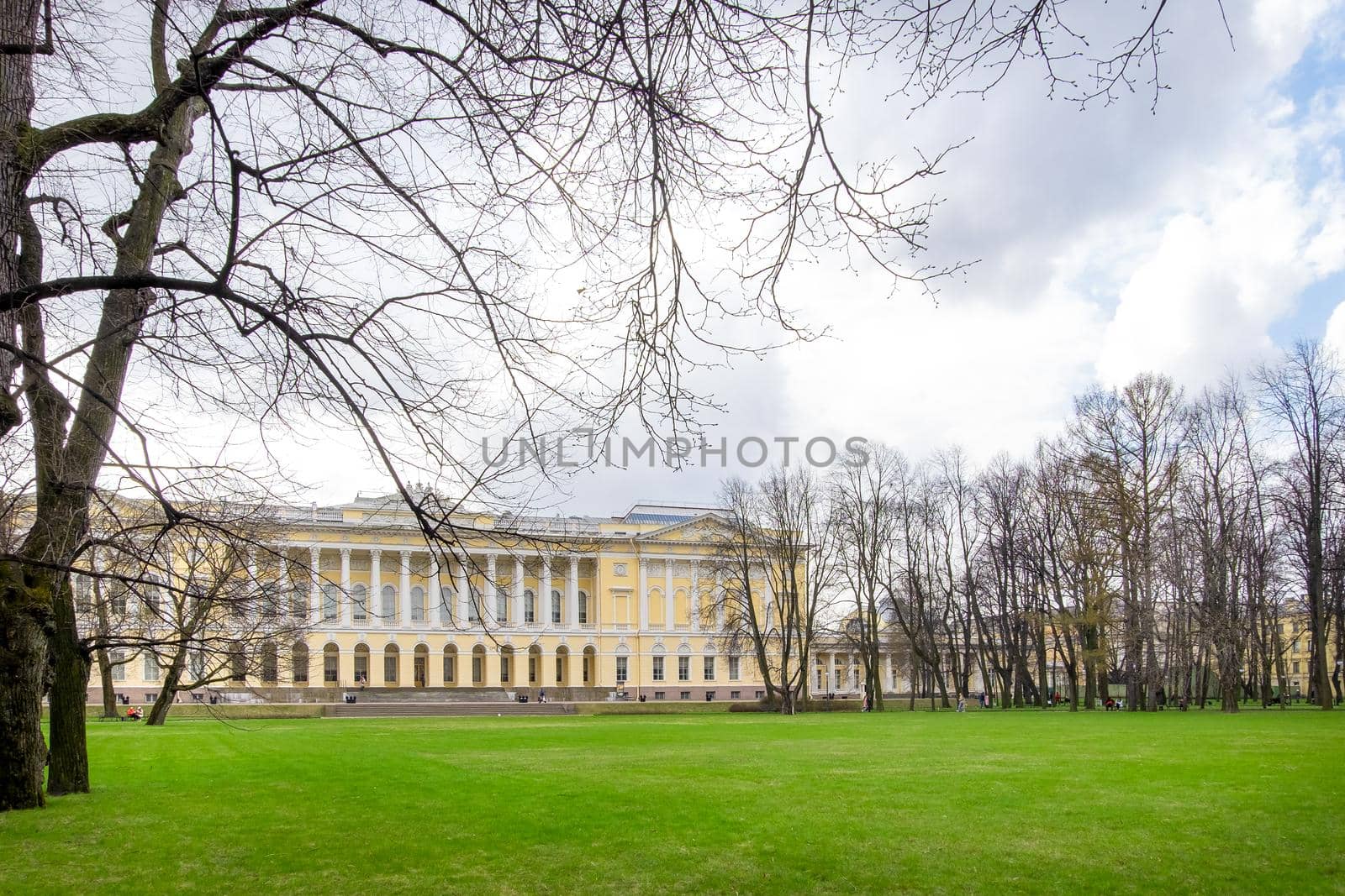 Saint Petersburg, Russia - May 2, 2021. The northern facade of the Mikhailovsky Palace, the building of the State Russian Museum in early spring. Mikhailovsky Garden. Selective focus.