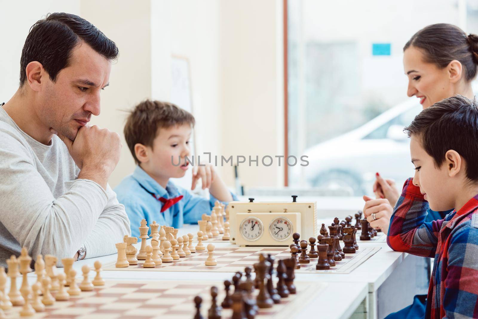 People in chess school learning the game