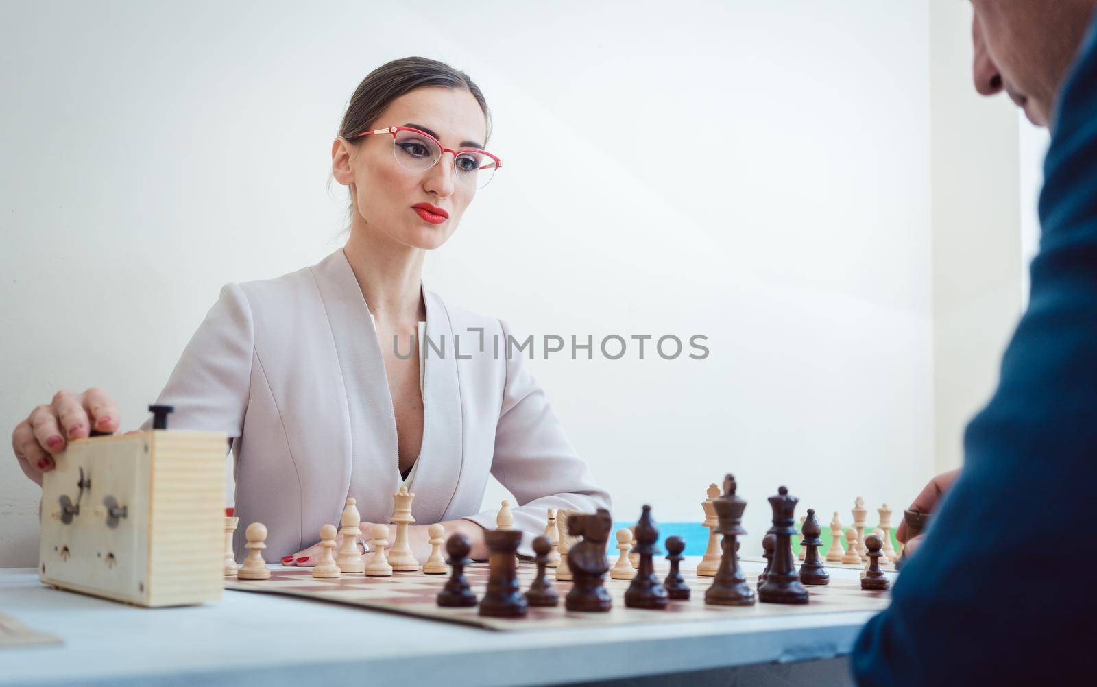 Business people playing chess, concept picture