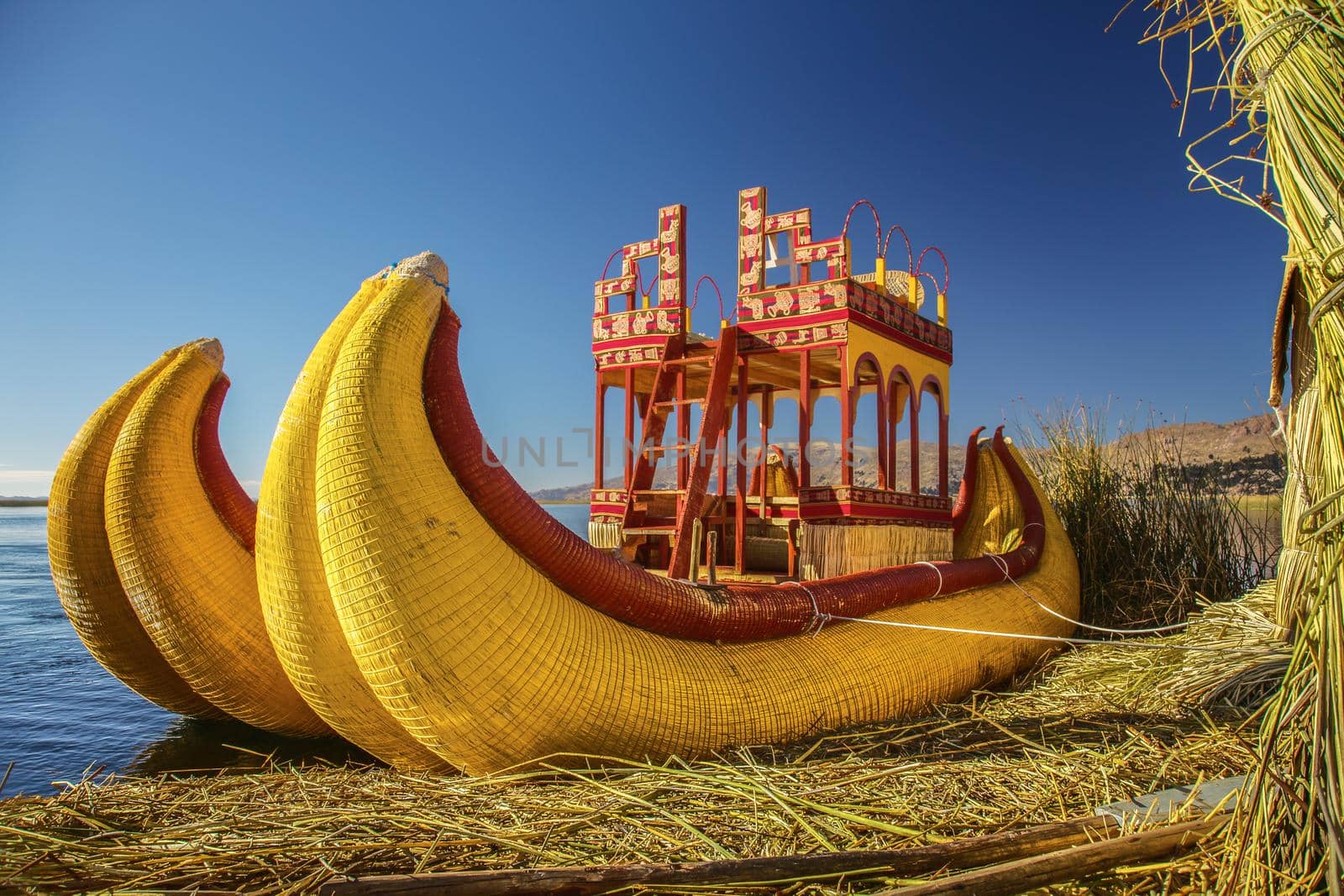 Reed boat on Floating Island of Uros at Lake Titicaca in Peru and Bolivia by wondry