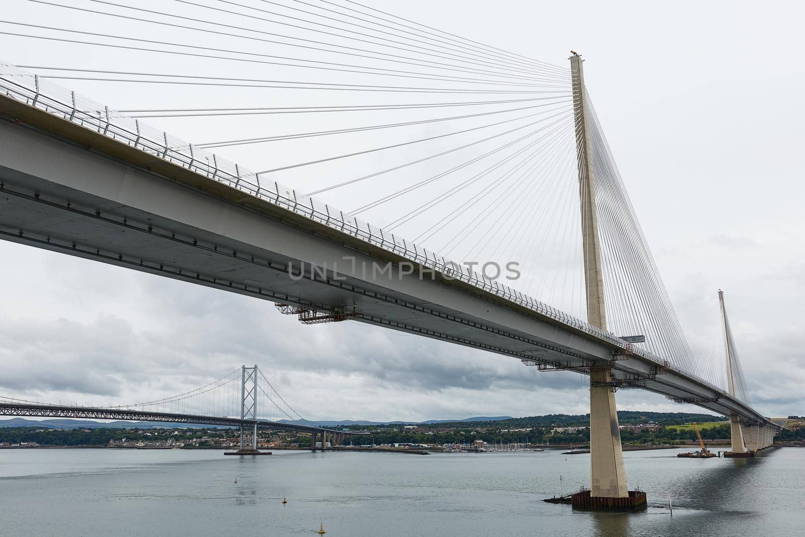 The new Queensferry Crossing bridge over the Firth of Forth with the older Forth Road bridge in Edinburgh Scotland