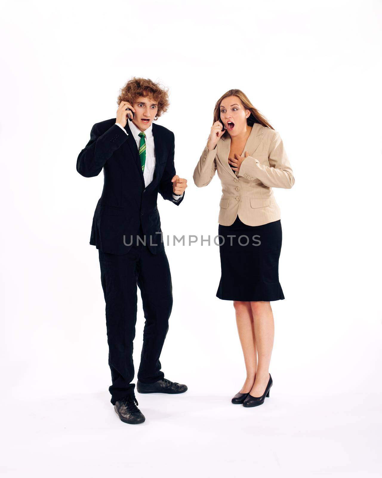 Business people - both are on their mobile phone, he is shouting in his cell phone