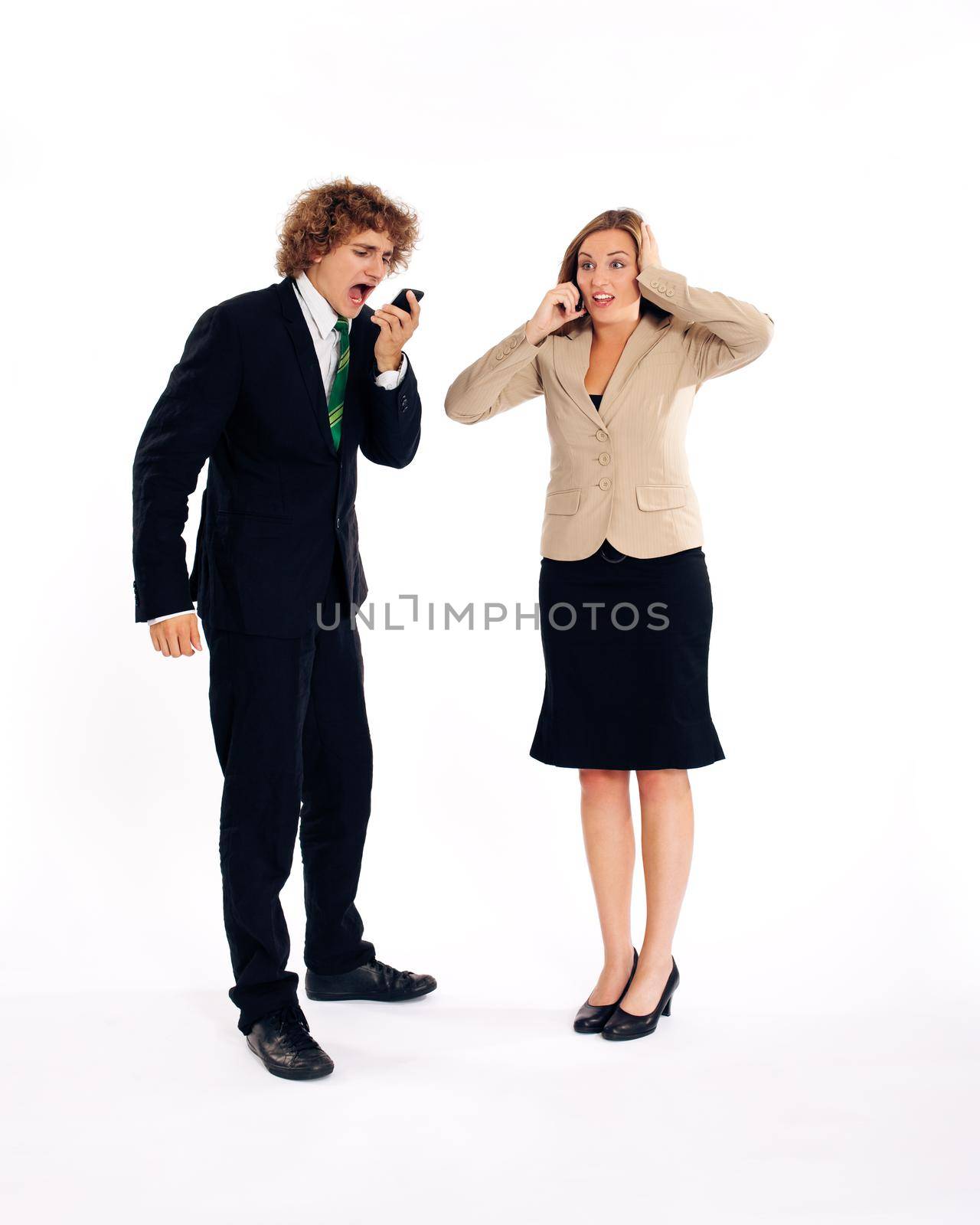 Business people - both are on their mobile phone, he is shouting in his cell phone