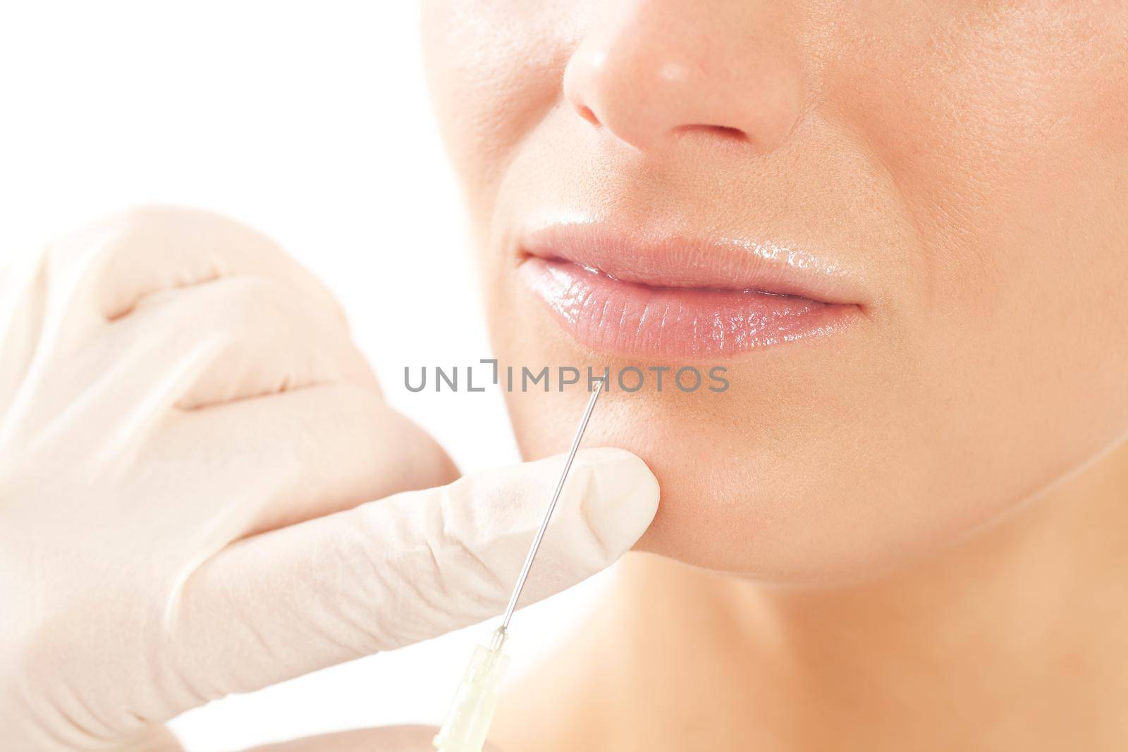 Botox - Age and beauty; a doctor is doing the injection
